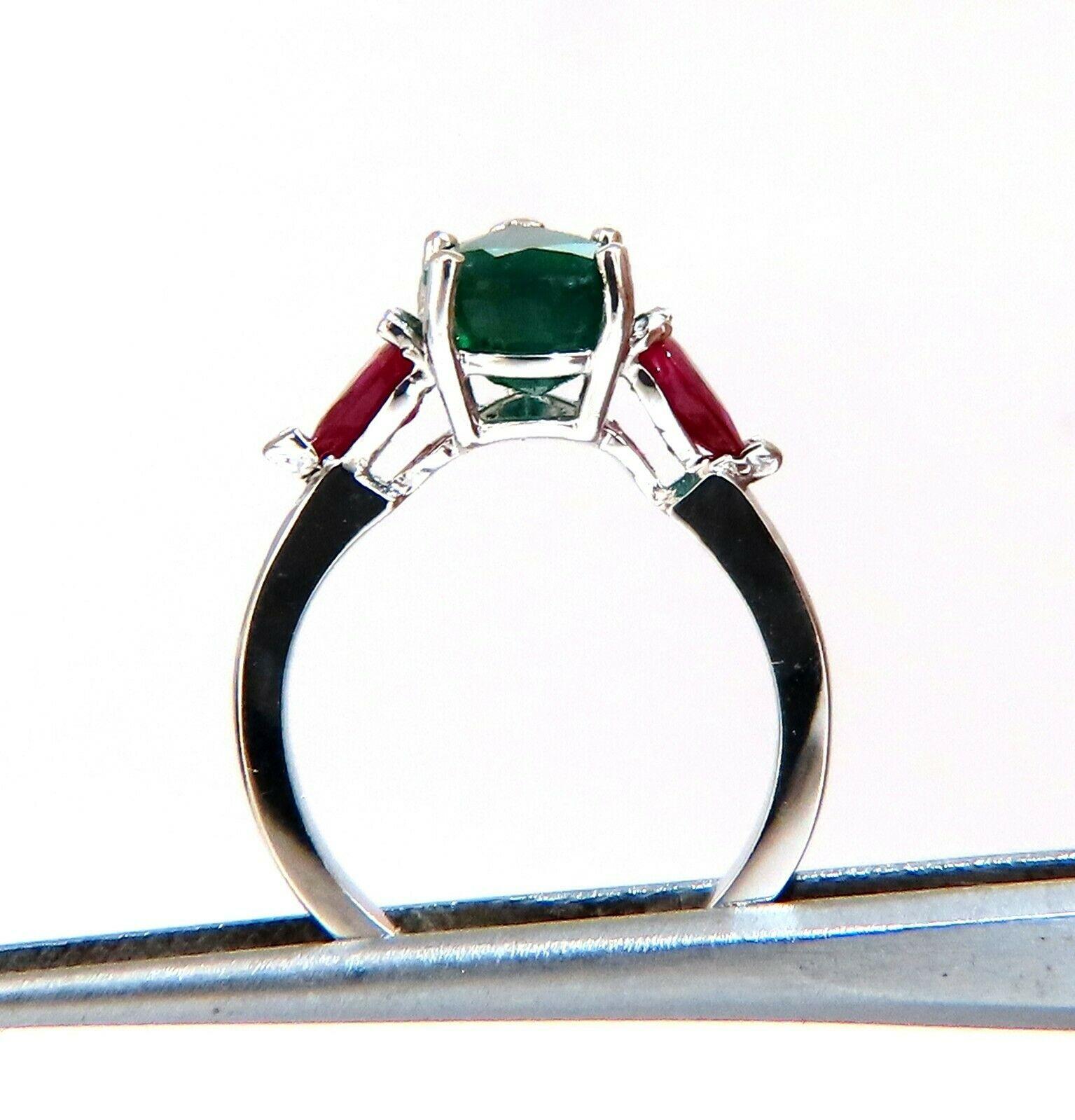 2.26 carat natural pair shaped emerald ring.

9x7 emerald, even green clean clarity and transparent.

.75 carat natural pear-shaped rubies on side.

Even Red Clean clarity and transparent

14 karat white gold 3.5 grams

Depth of ring 6.7 mm

Size 5