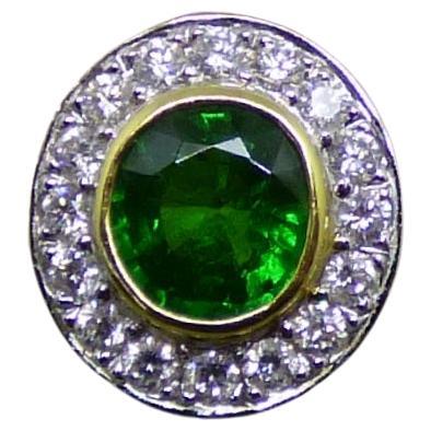 3.01ct Oval Tsavorite Garnet and Diamond Cluster Ring in 18K gold For Sale
