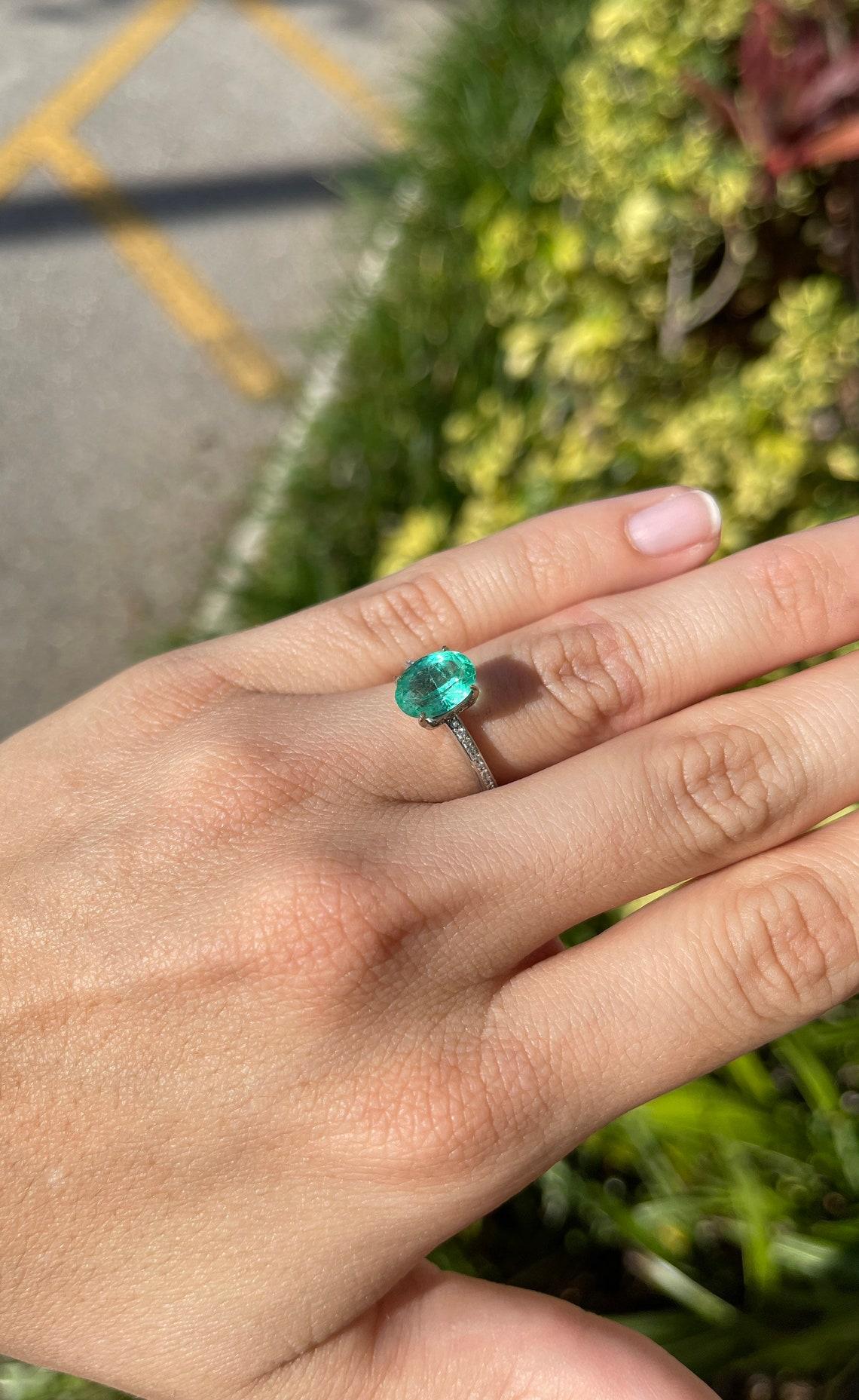 light emerald engagement rings