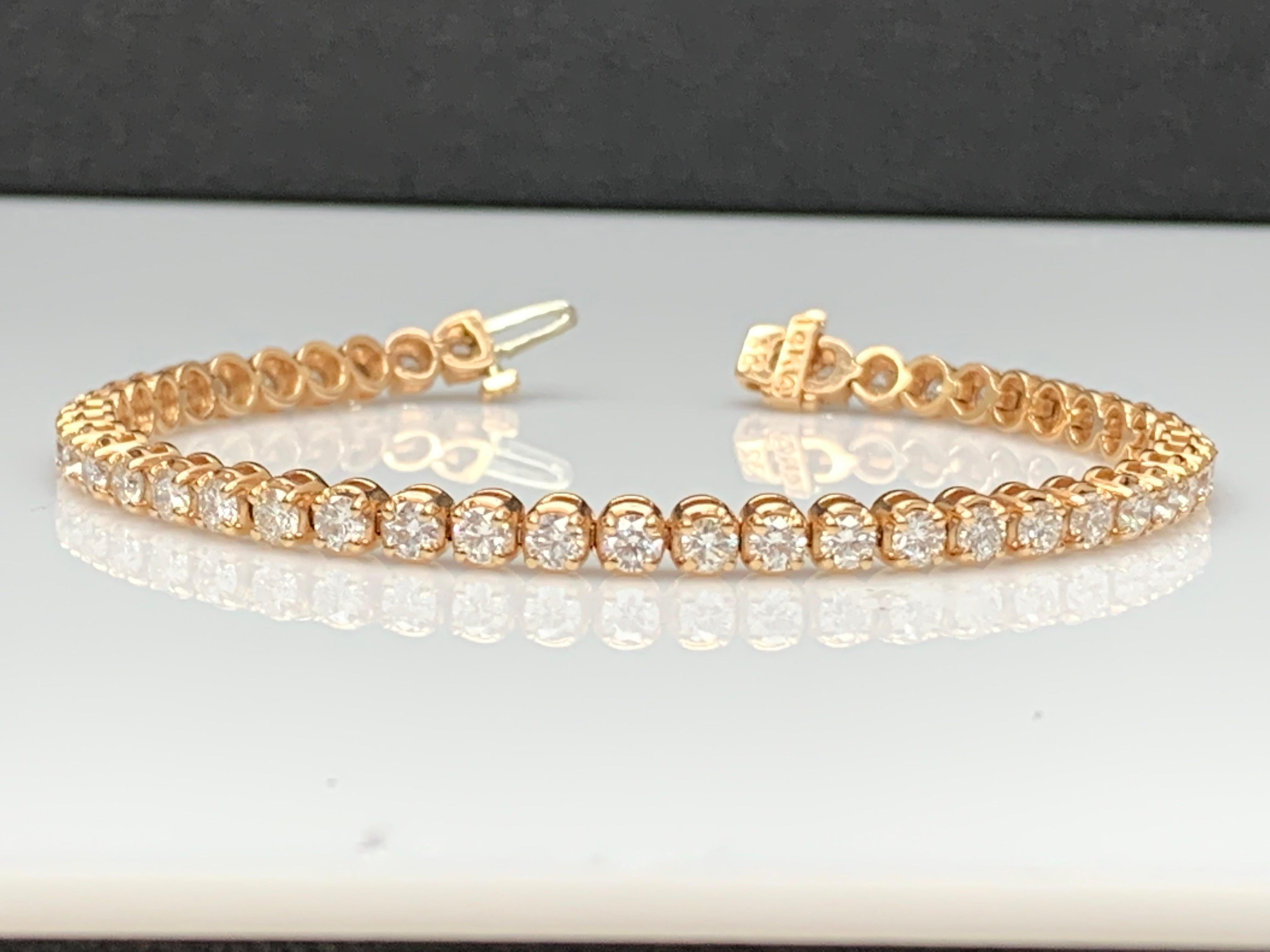 A classic tennis bracelet style showcasing a row of round brilliant diamonds, set in a polished 14k rose gold mounting. 57 Diamonds weigh 3.02 carats total and are approximately GH color, SI1 clarity.

Style available in different price ranges.