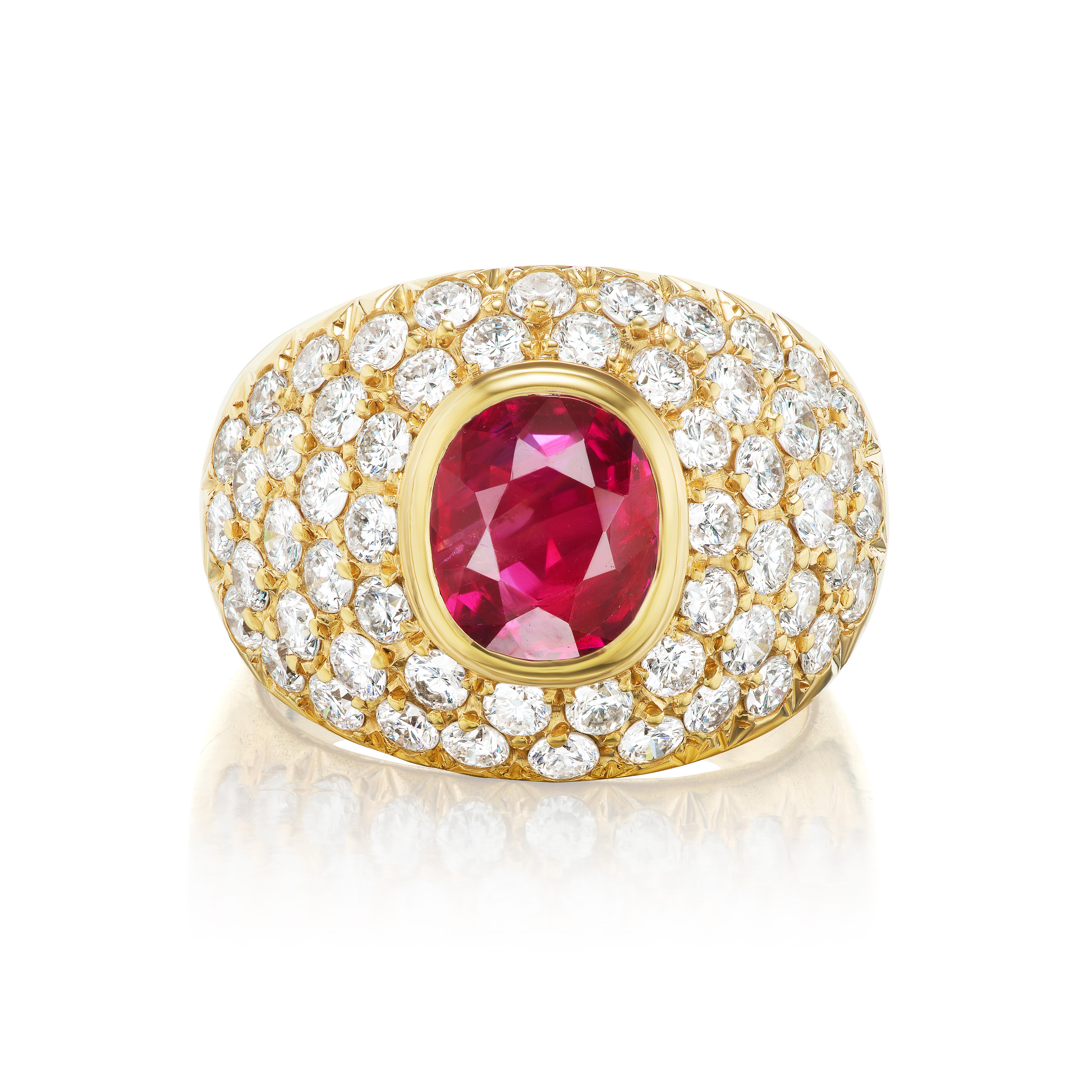 This magnificent cocktail ring features a 3.02 carat oval no heat Burma ruby. The ruby's red color is highly saturated and there exists some clarity characteristics consistent with typical Burma material. The ruby is bezel set in a fantastic diamond