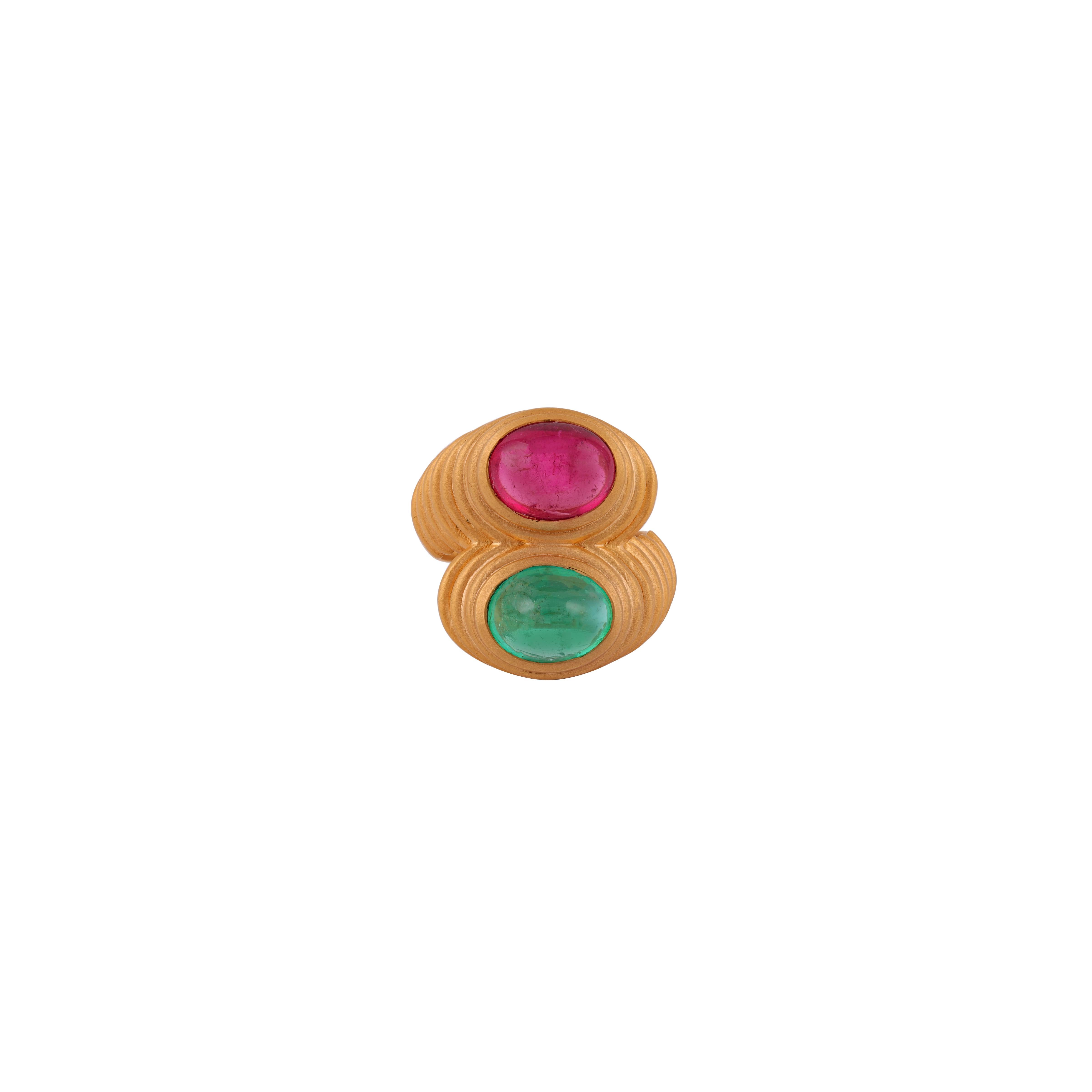 This ring has a mesmerizing Cabochon Cut Emerald weighing 3.02 Carats and Ruby Light weighing 3.07 Carats. 

It is set in 18K  Gold and weighs approximately 11.39 grams.

The ring size is 7  and can be re-sized at no additional charge.