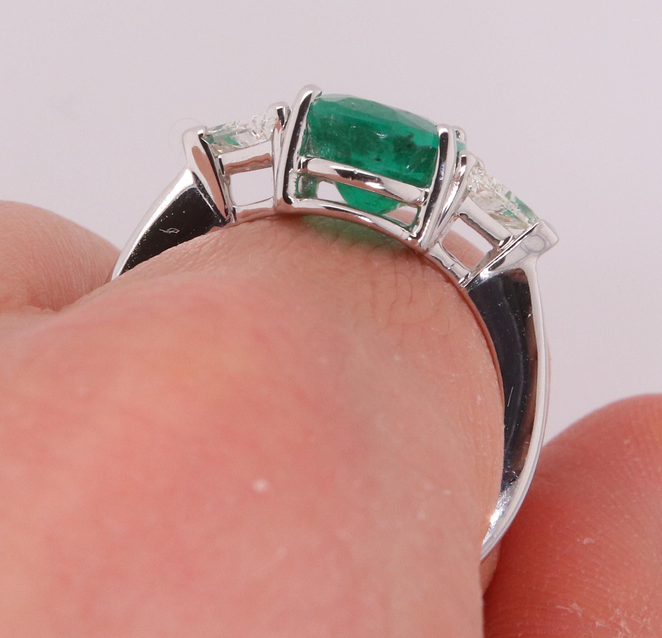 Contemporary Oval Emerald and Trillion Diamond Three Stone Engagement Ring