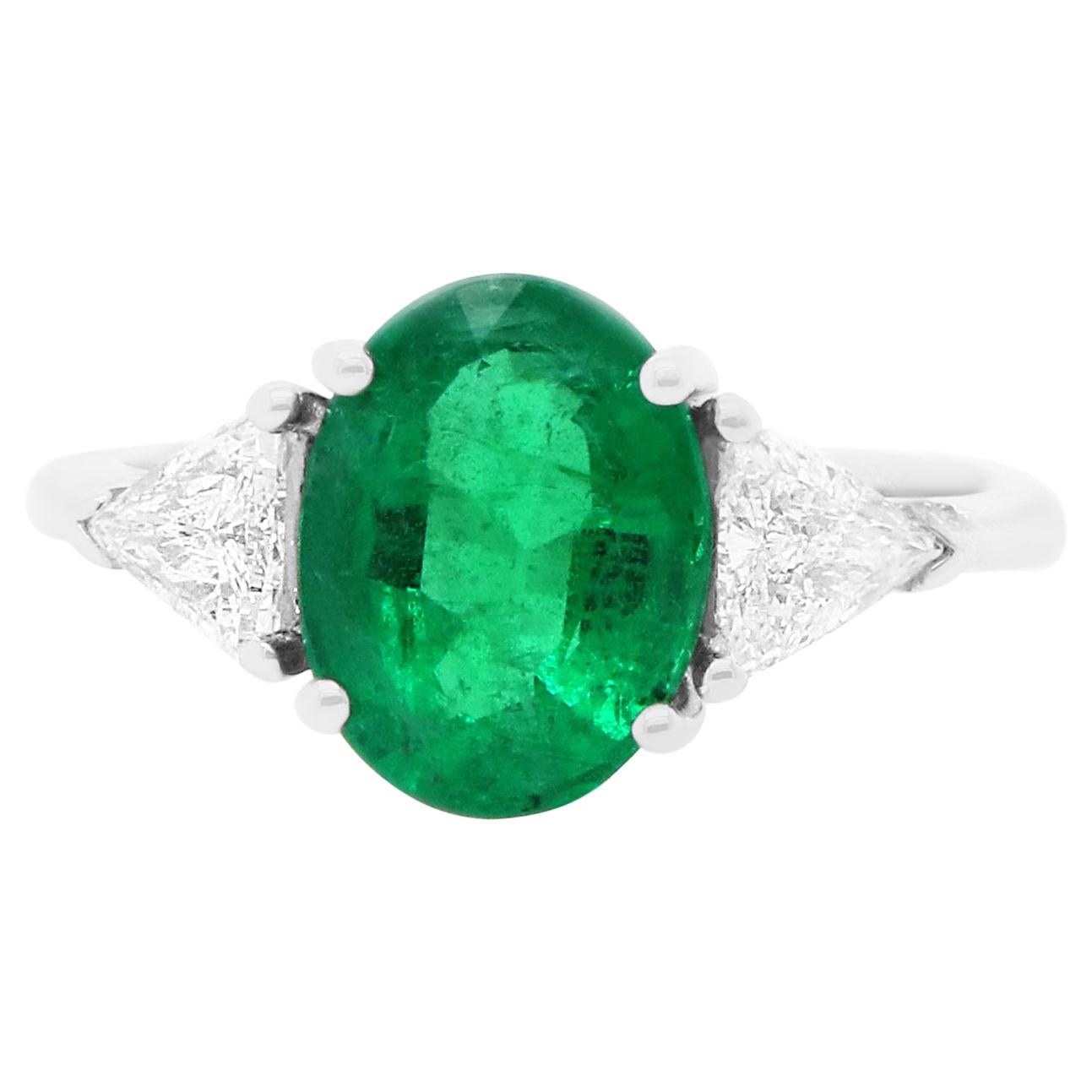 Oval Emerald and Trillion Diamond Three Stone Engagement Ring