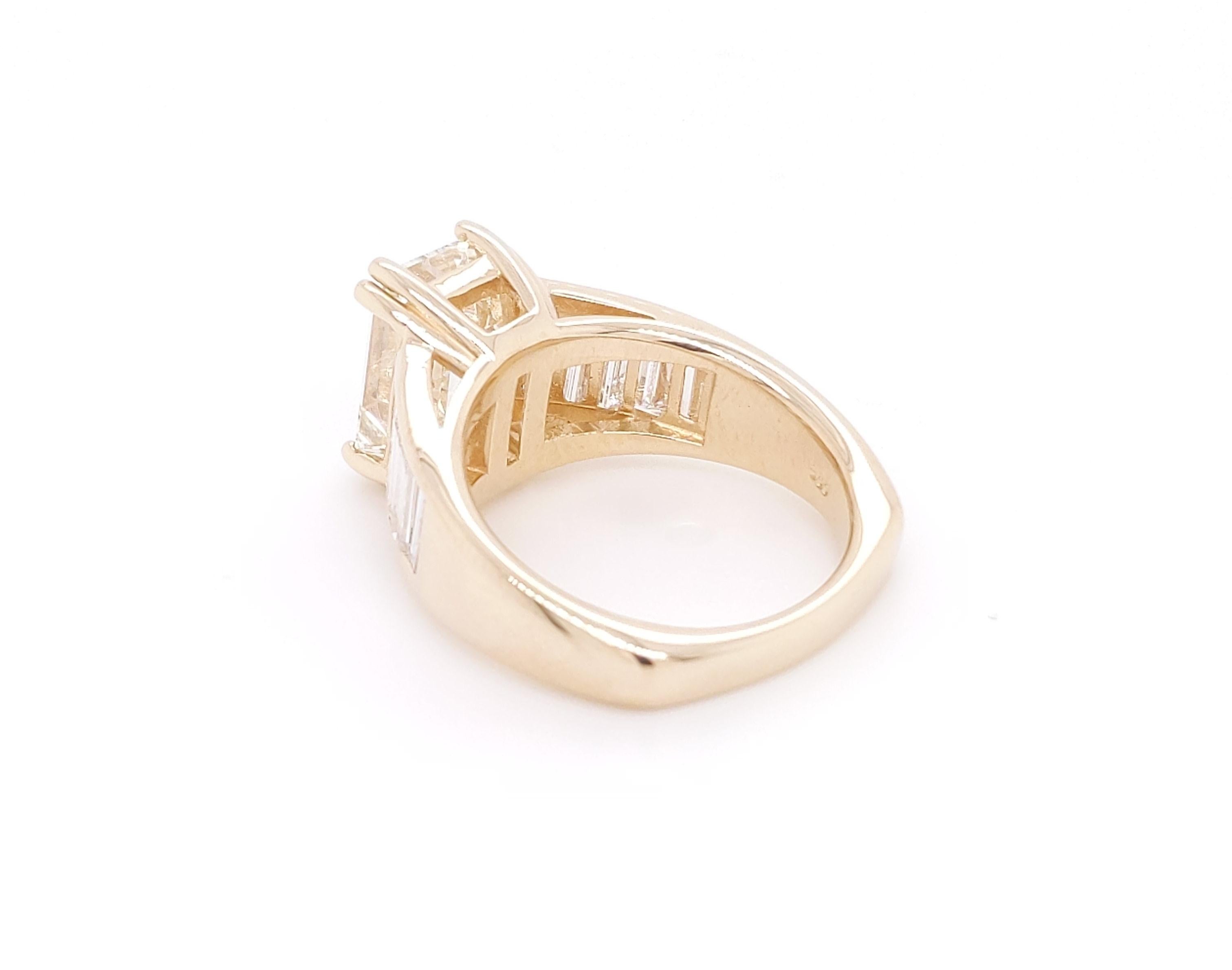 Elegant, sleek, custom made ring ring one of one. Inspired by Jolie/Pitt engagement ring. 4.42 carats total weight of diamond. This ring is made in 14 karat yellow gold  that weighs 6.6 grams. It feature 5 tapered diamond baguettes per side per side