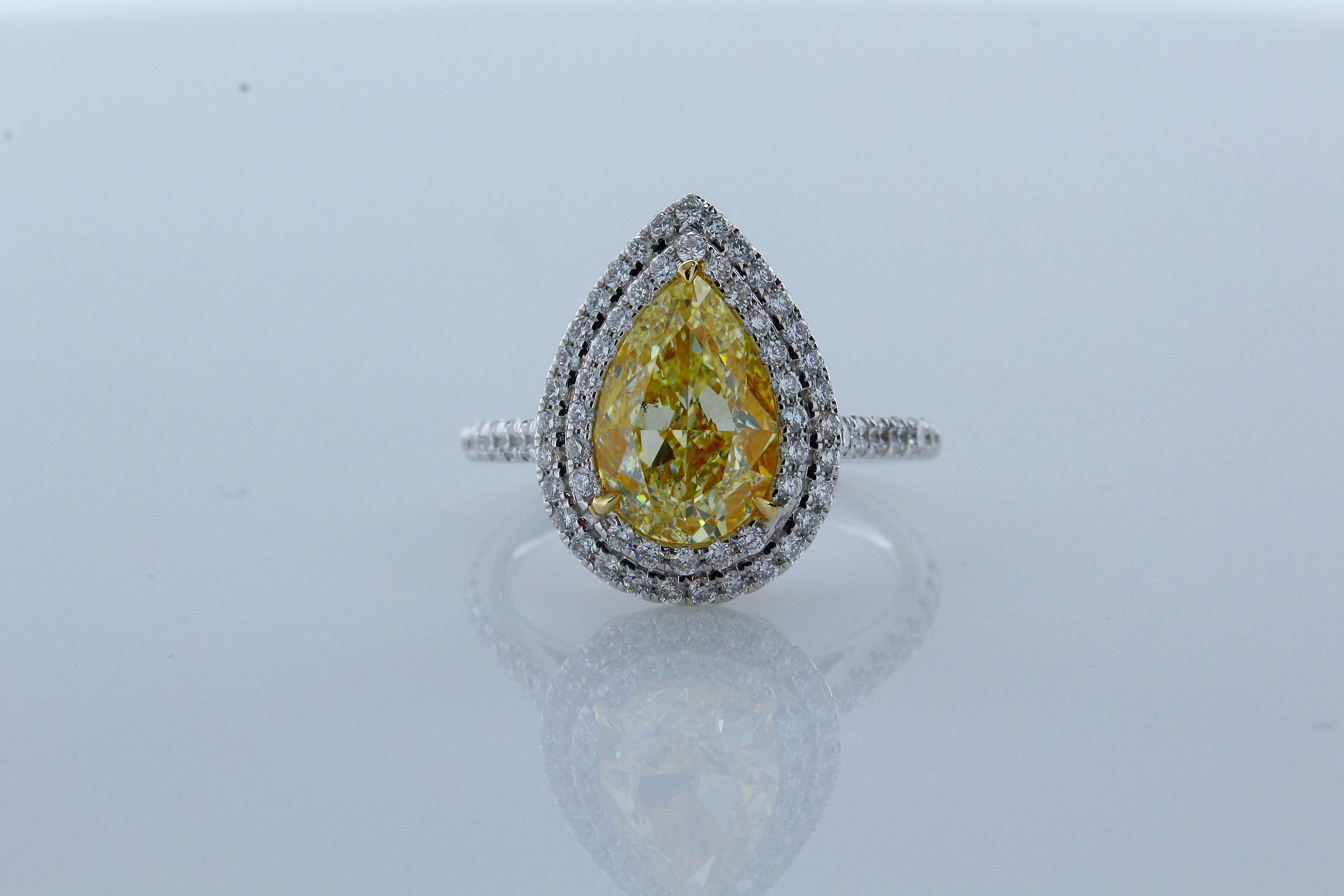 Incredible Deal on  3.02 Carat Pear Shape Natural Fancy Yellow Color SI1 Clarity Diamond 18 Karat White Gold Convertible Ring/Pendant.
11.14x7.43x4.81 millimeter. Total Carat Weight on the ring is 3.71. 

This Ring converts into pendant with classic
