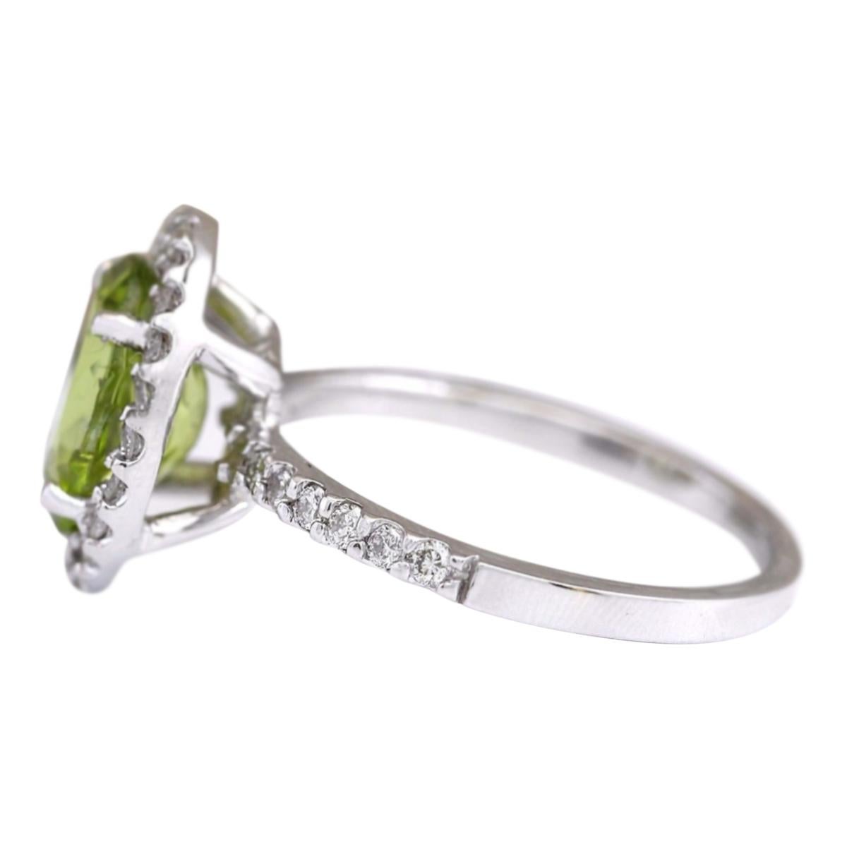 Stamped: 14K White Gold
Total Ring Weight: 3.6 Grams
Total Natural Peridot Weight is 2.62 Carat (Measures: 10.00x8.00 mm)
Color: Green
Total Natural Diamond Weight is 0.40 Carat
Color: F-G, Clarity: VS2-SI1
Face Measures: 13.60x11.45 mm
Sku: