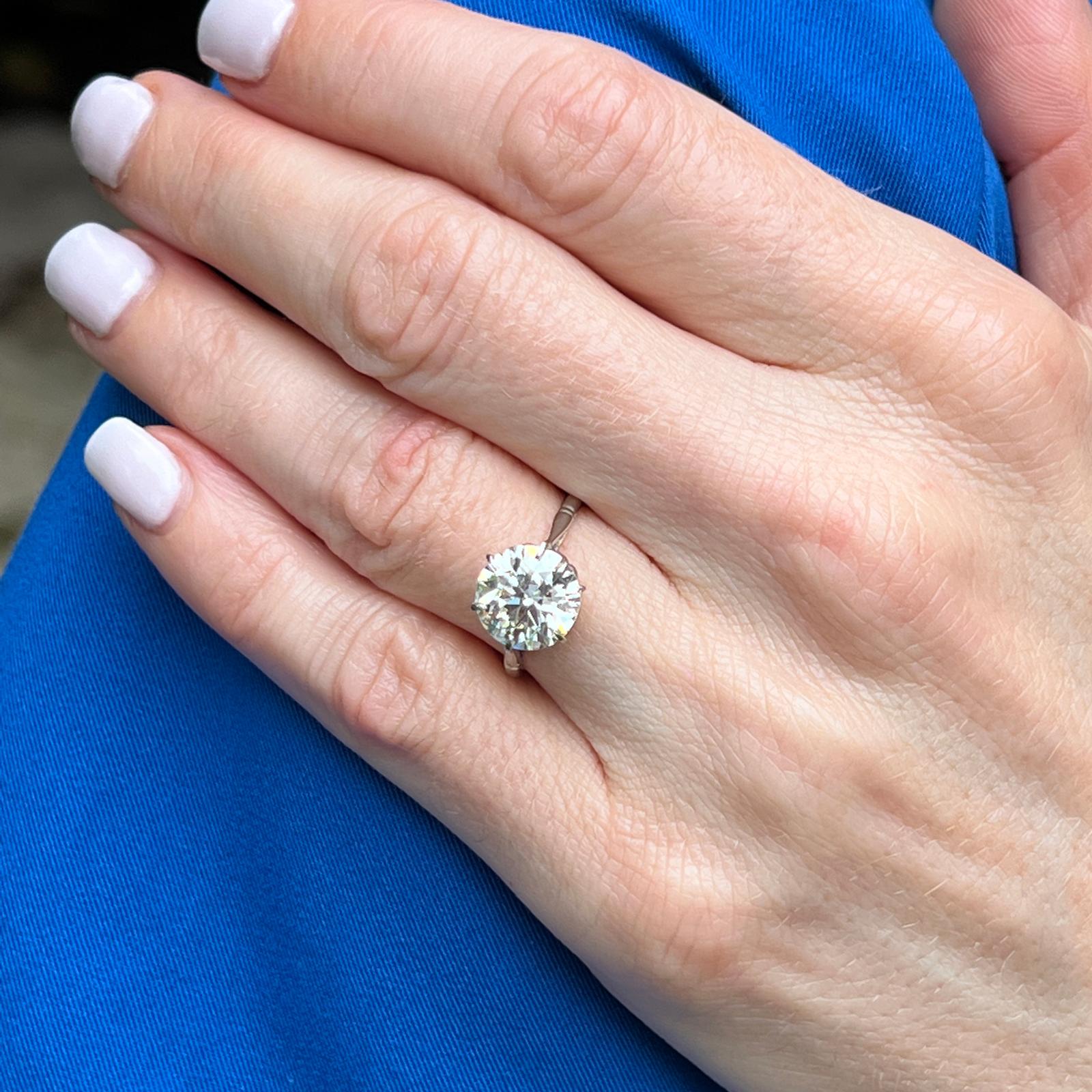 Beautiful Art Deco diamond engagement ring handcrafted in platinum. The 3.02 carat Old European cut diamond is graded by the GIA M color and VS2 clarity. The platinum 6 prong original mounting is currently size 5.25 (can be sized), and the shank