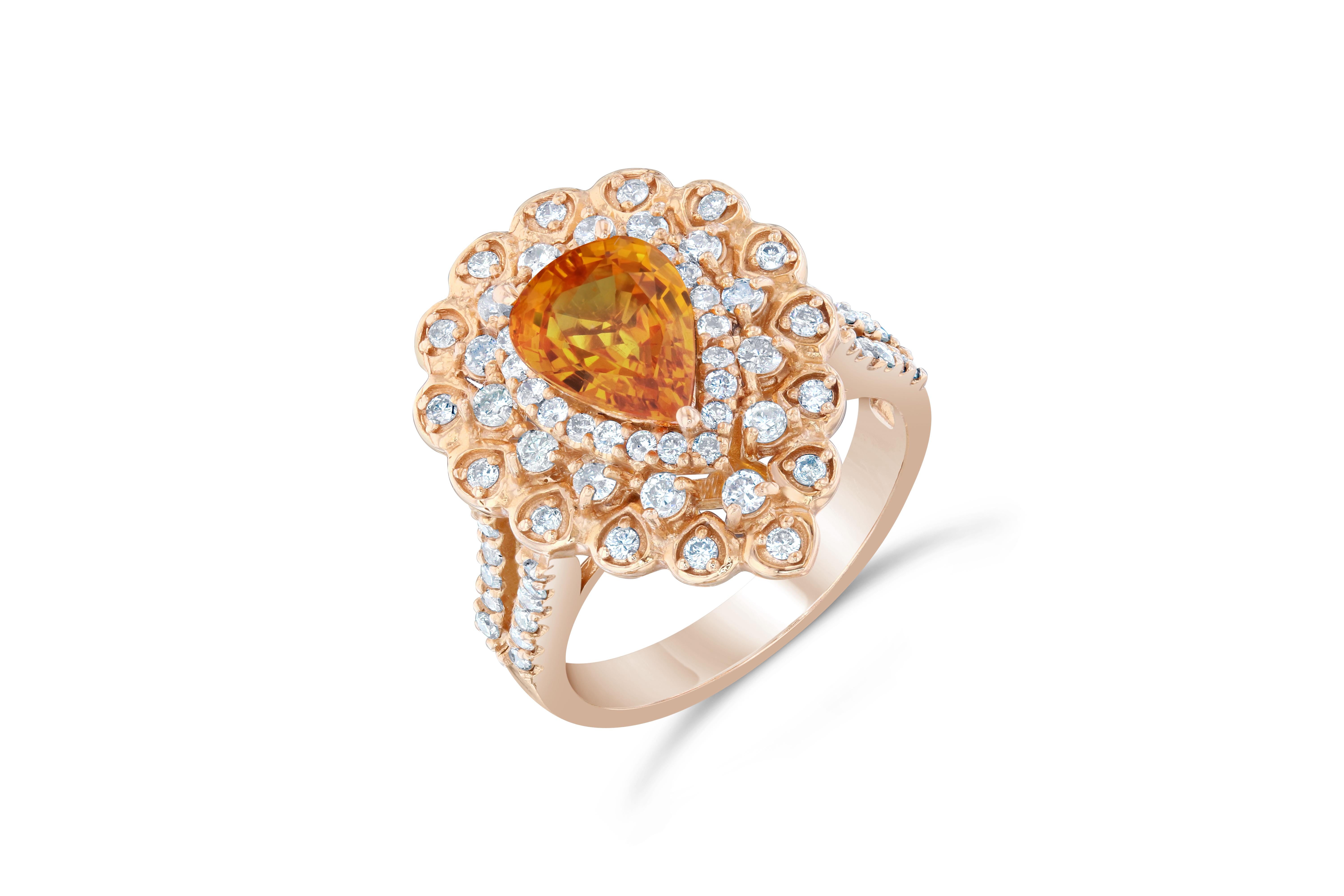 This beautiful ring has a Natural Pear Cut Orange Sapphire that weighs 2.14 Carats. 

It has 74 beautiful Round Cut Diamonds adorning the orange sapphire and they weigh 0.88 Carats. The diamonds have a clarity and color of VS-H. The total carat