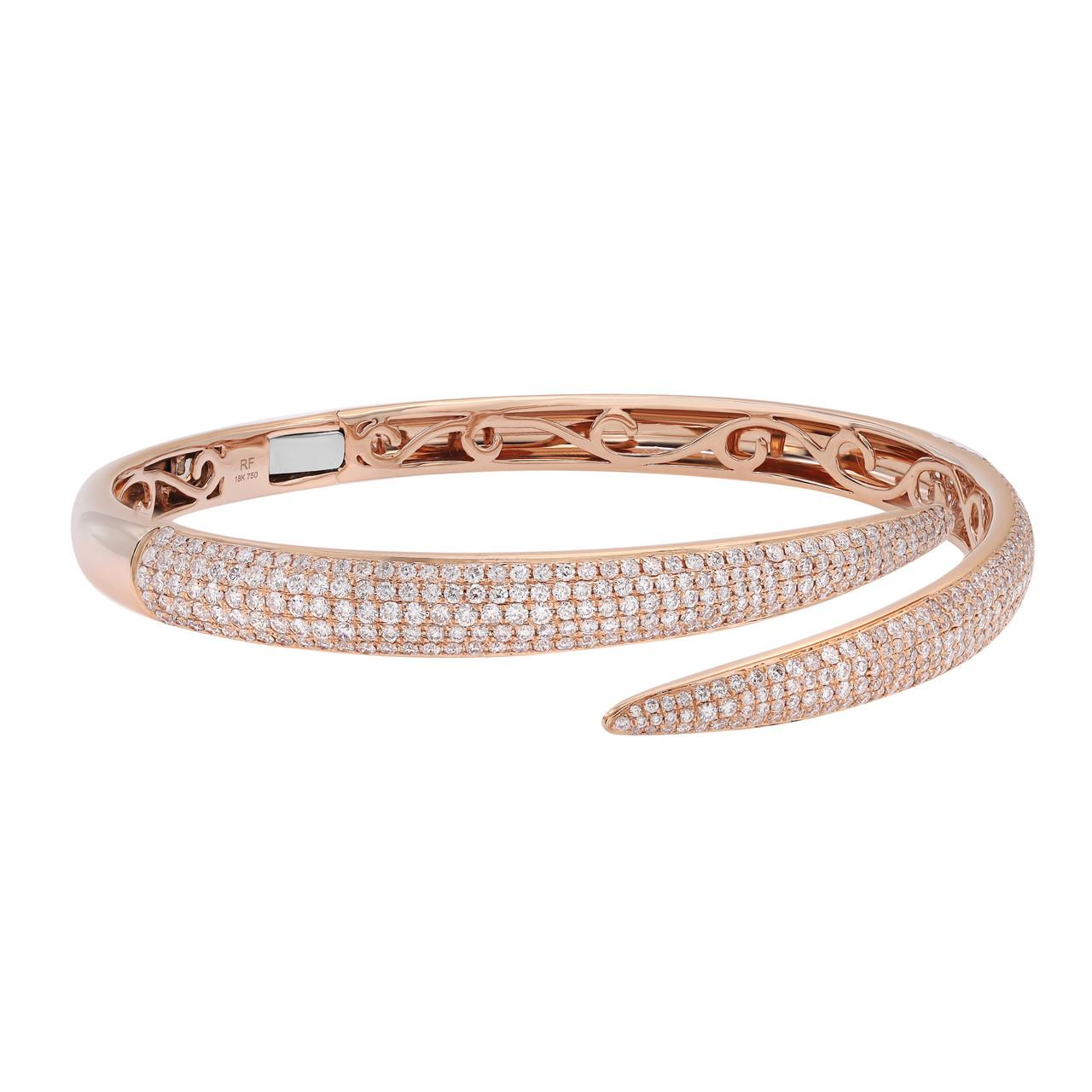 Indulge in the allure of our 3.02 Carat Pave Set Round Cut Diamond Bangle Bracelet, crafted in exquisite 18K rose gold. This stunning piece exudes a delicate and romantic charm. The bracelet features a captivating arrangement of round-cut diamonds,