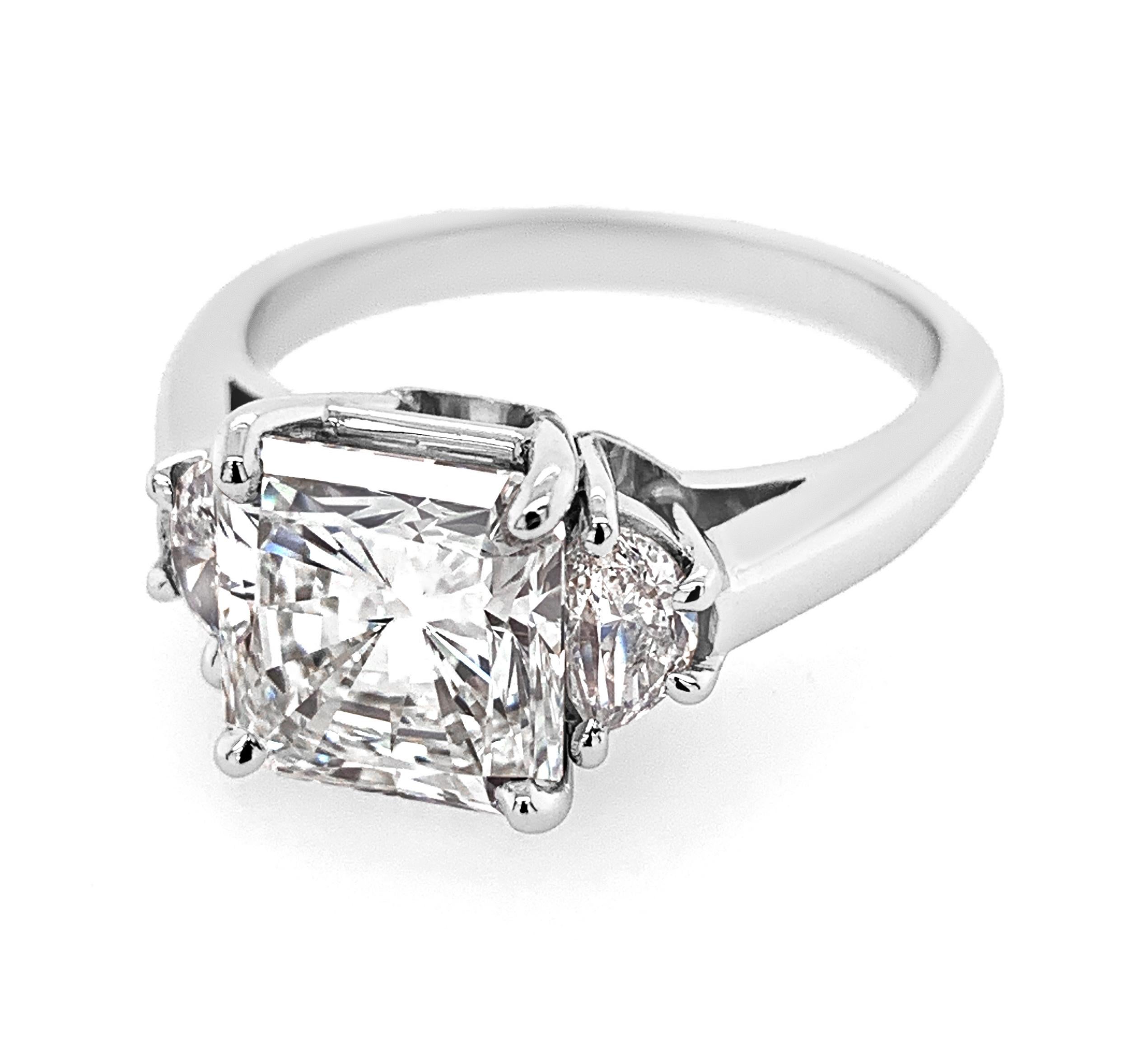 3.02 Carat Radiant Cut Diamond Platinum Ring with 0.46 Carat (total weight) Half-Moon side Diamonds.  Center stone is H color, VVS1 clarity.  Ring is Platinum.  Finger size is 6.75.

