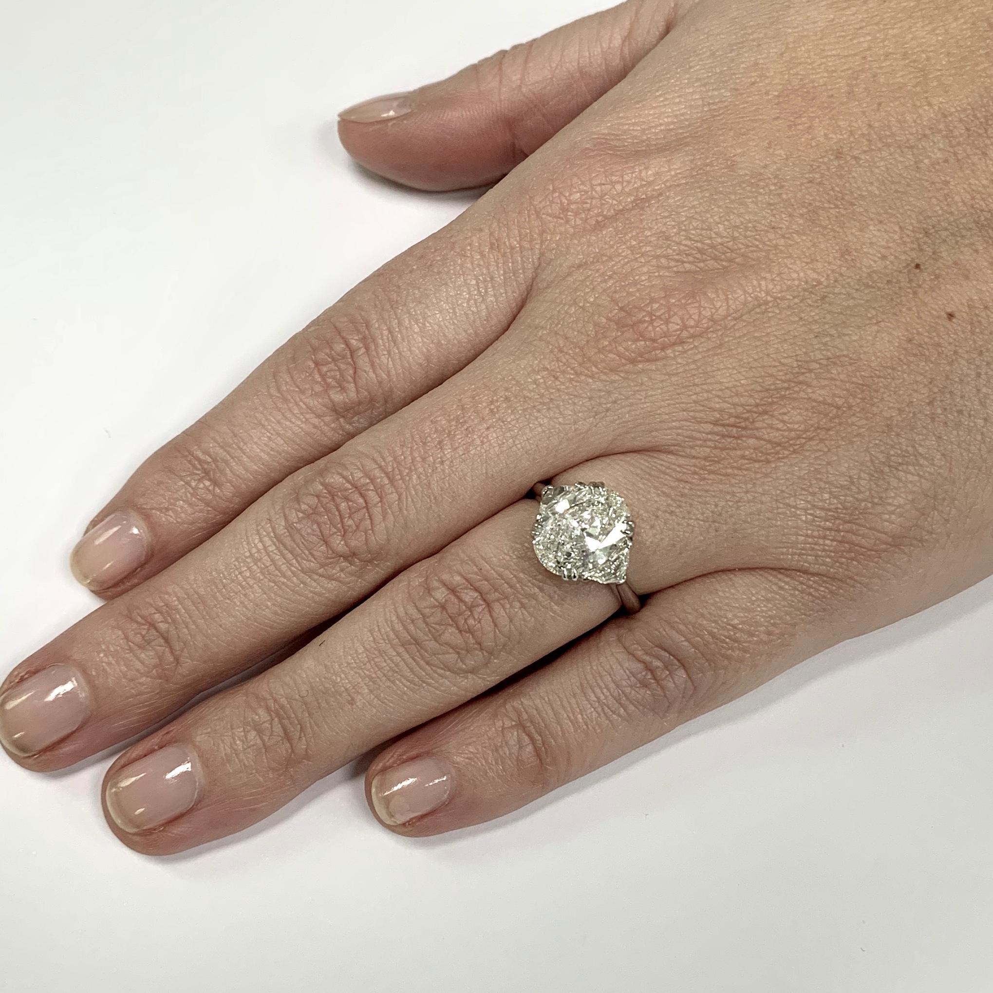 oval engagement ring with epaulettes