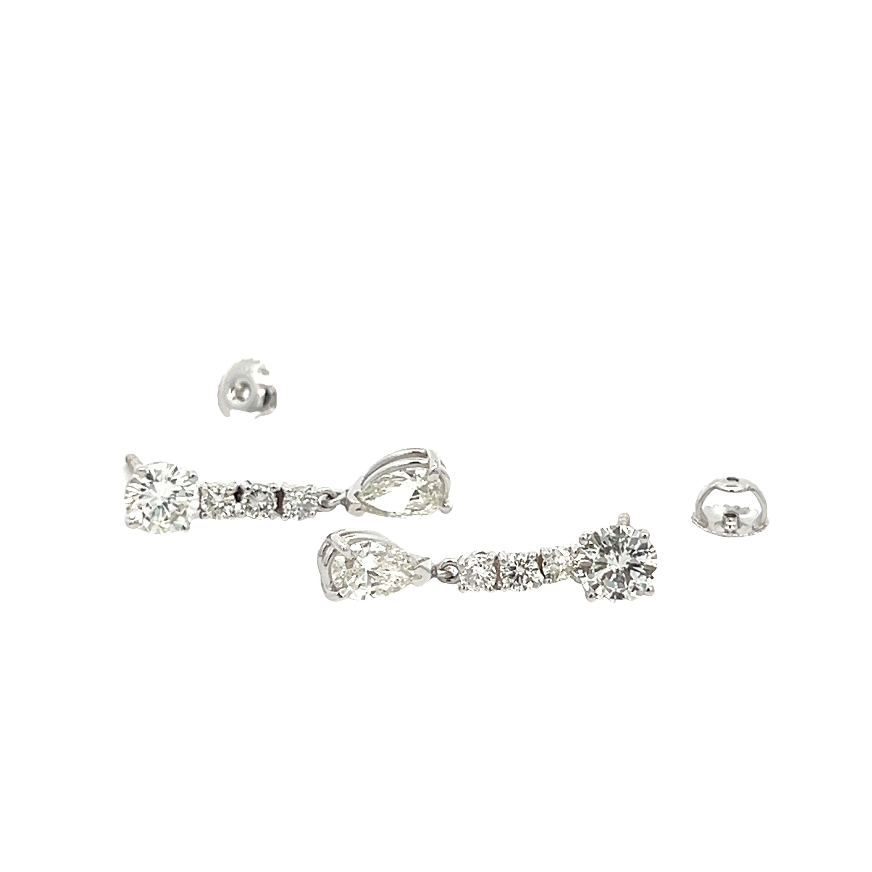 Professional jewelers in the Diamond District of New York City make these Gorgeous earrings pair. Diamonds are of exceptional quality, giving a white Siberian sparkle, it has Brilliant Pear-shaped Diamonds that will draw all eyes on you. These pair