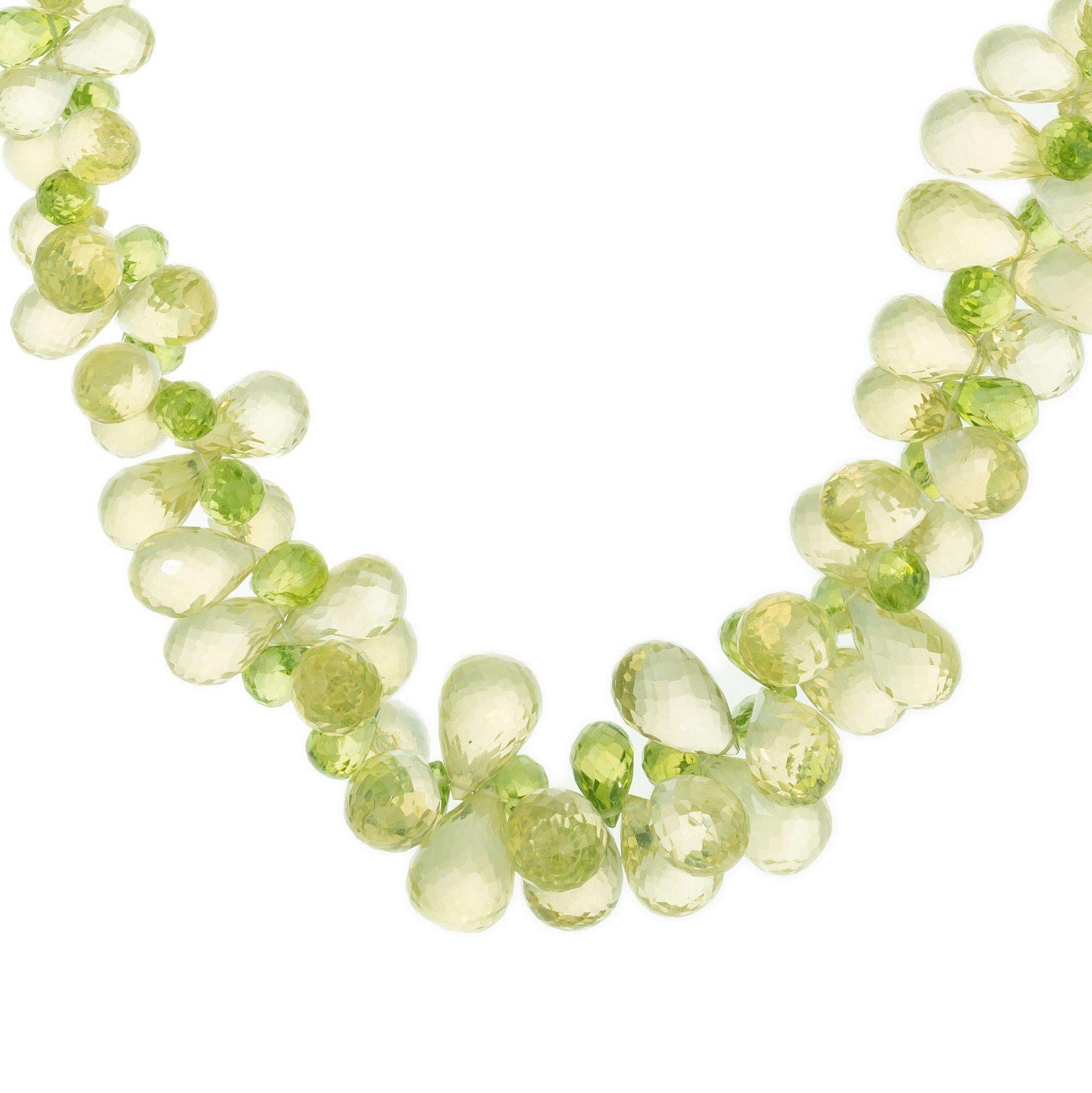 Pear peridot and citrine green and yellow briolette bead gold necklace. The 200 graduated briolette beads boasts a harmonious blend of vibrant yellow and green peridot and citrine gemstones beautifully arranged in a cluster design. The carat weight
