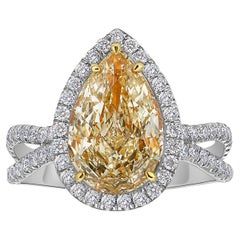 Bague halo de diamants jaune clair poire de 3 carats VS1