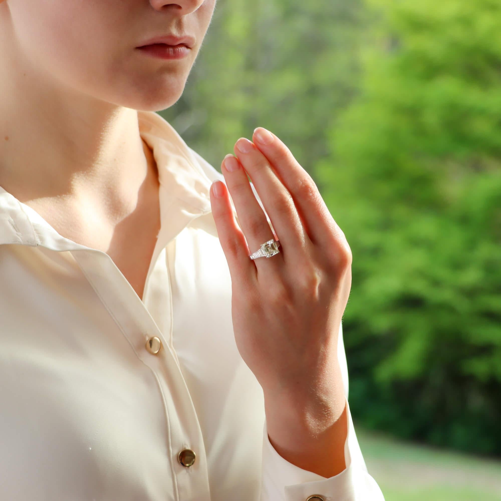 A sensational square emerald cut solitaire engagement ring set in platinum.

The ring is predominantly set with a sparkly 3.02 carat square emerald cut diamond which is four claw set securely. The diamond is set in a beautiful handcrafted mounting