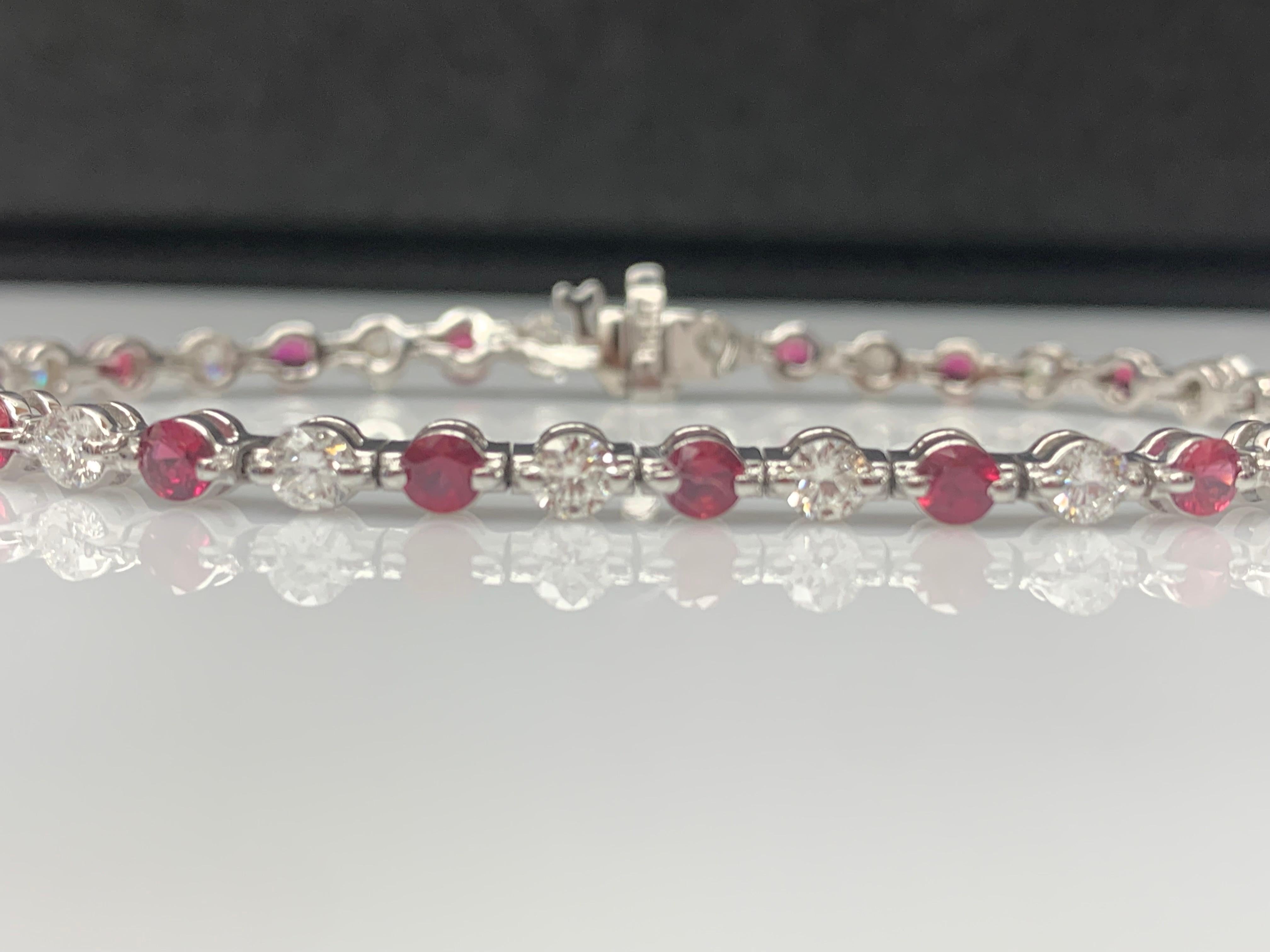 A stunning bracelet set with 18 Vibrant Red Rubies weighing 3.03 carat total. Alternating these rubies are 18 sparkling brilliant-cut round diamonds weighing 2.88 carats in total. Set in polished 14k white gold. Double lock mechanism for maximum