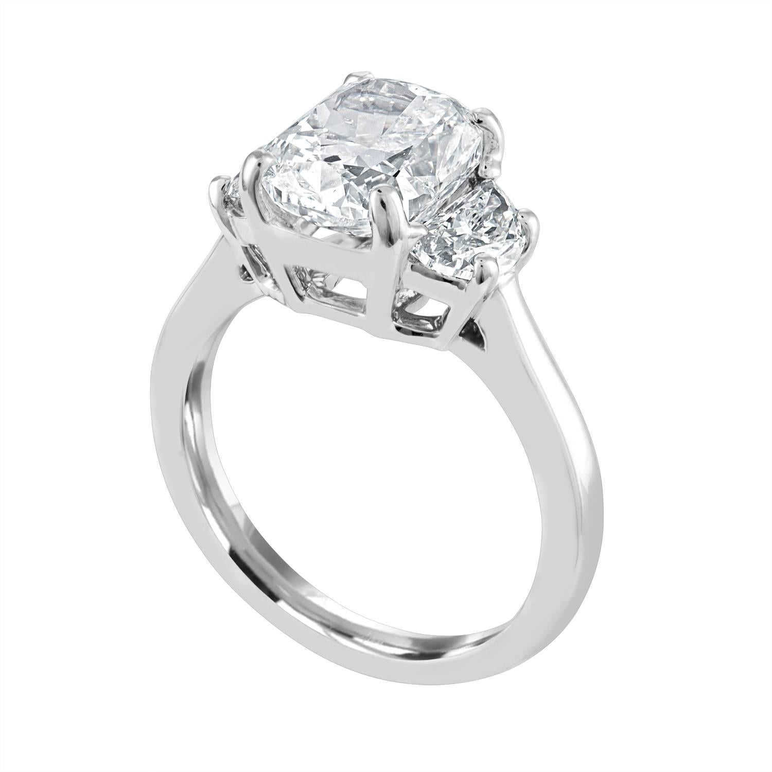 Contemporary 3.03 Carat Cushion, GIA Certified, Set in Three-Stone Platinum Ring