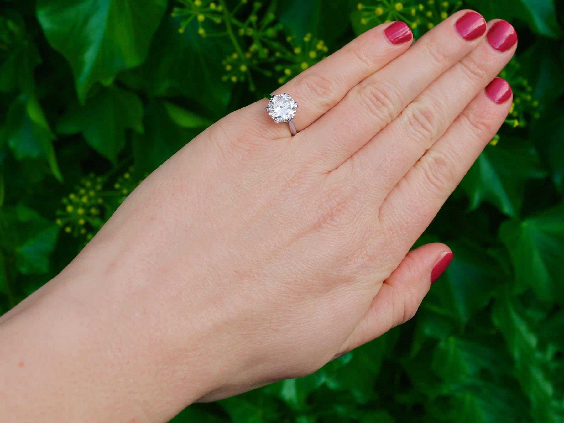 A stunning, fine and impressive vintage 3.03 carat diamond solitaire ring in platinum; part of our vintage engagement ring collections.

This stunning vintage solitaire ring has been crafted in platinum.

The ring displays a 3.03 carat transitional