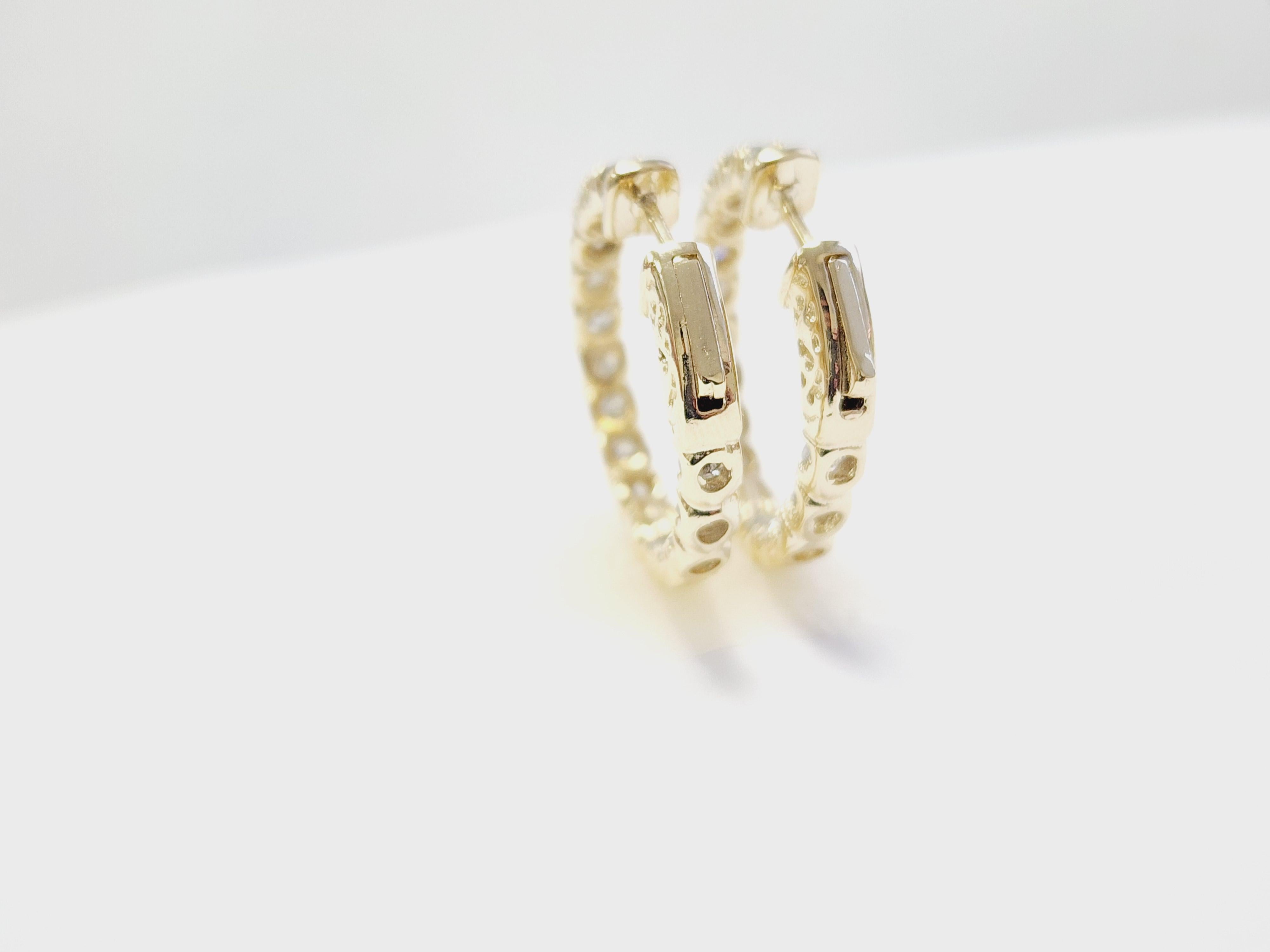Natural Diamond Inside-Out Hoop Earrings in 14K Yellow Gold

Refined and radiant, these elegant inside-out hoop earrings are crafted in 14K yellow gold and set with natural diamonds of Average of G color and I2 clarity. The design features diamonds