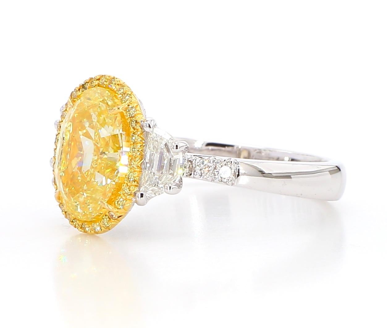 This 3.03 Carat Fancy Light Yellow GIA Certified Oval Cut Diamond Ring is a testament to fine craftsmanship and timeless design. Perfect for those who appreciate the beauty of natural diamonds, this ring offers a balance of luxury and tasteful