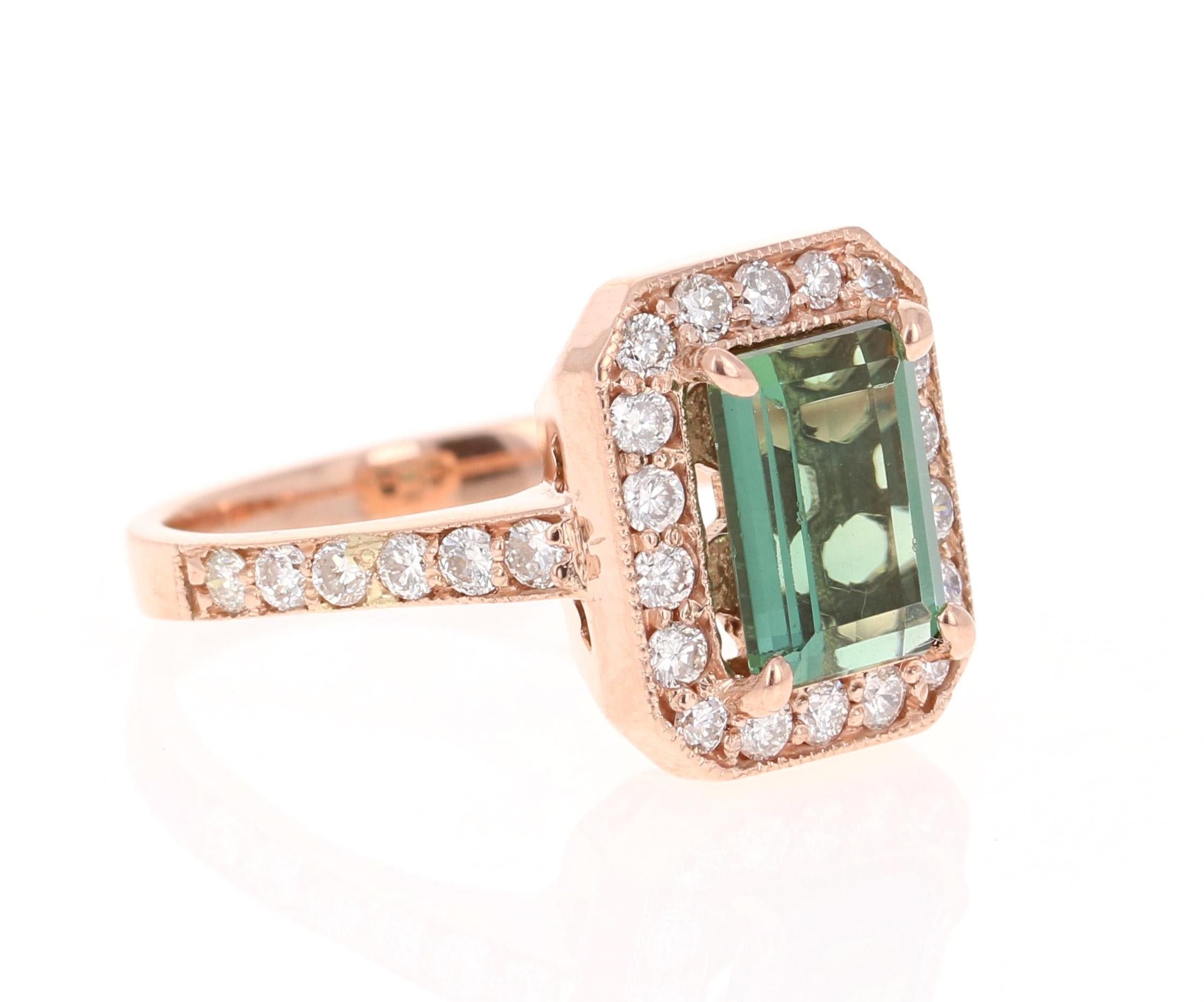 A beauty that is different and one of a kind. Can be a beautiful Engagement, Wedding, or Anniversary Ring. 

This ring has a magnificently beautiful Emerald Cut Green Tourmaline that weighs 2.32 Carats and has 36 Round Cut Diamonds weighing 0.71