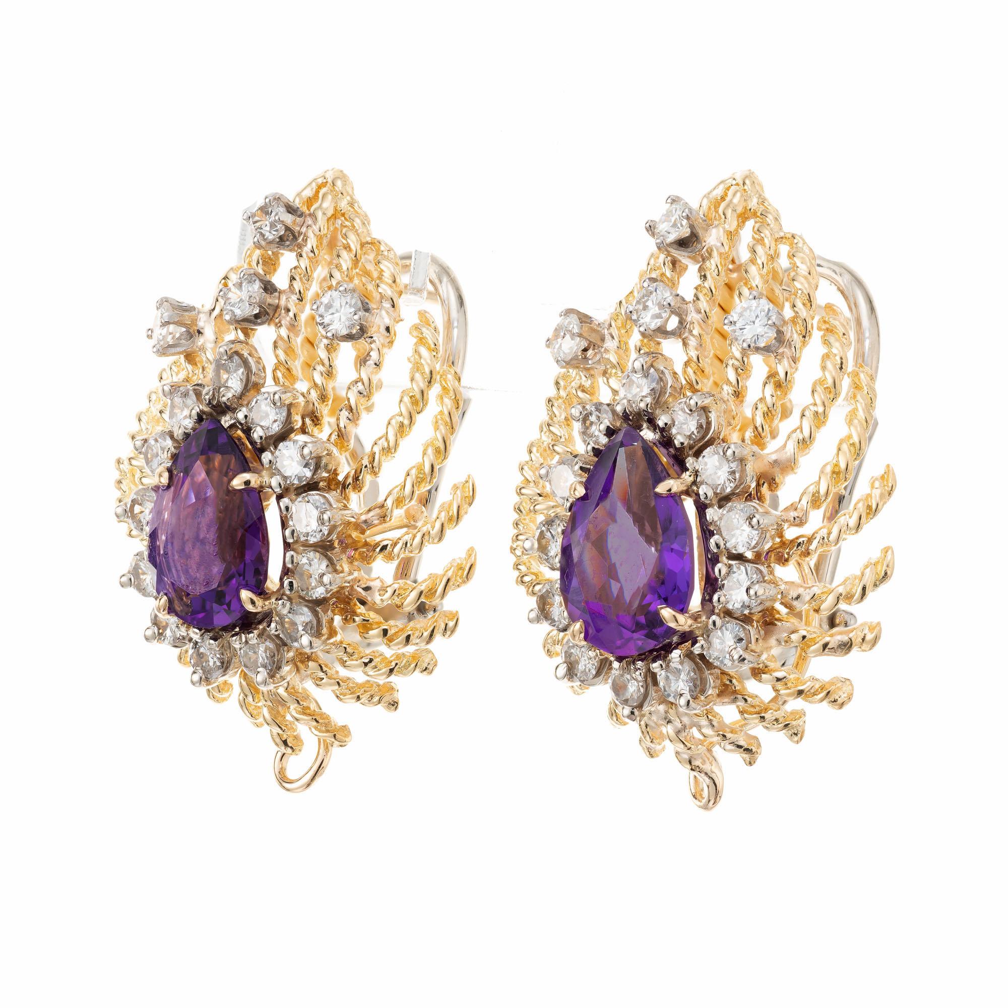 1960's Amethyst and diamond Twisted wire clip post earrings. 2 k bright pear shaped purple amethyst center stones set in 18k yellow gold settings with 34 round brilliant cut diamonds.  The earrings and posts are 18k yellow gold, the clip backs are