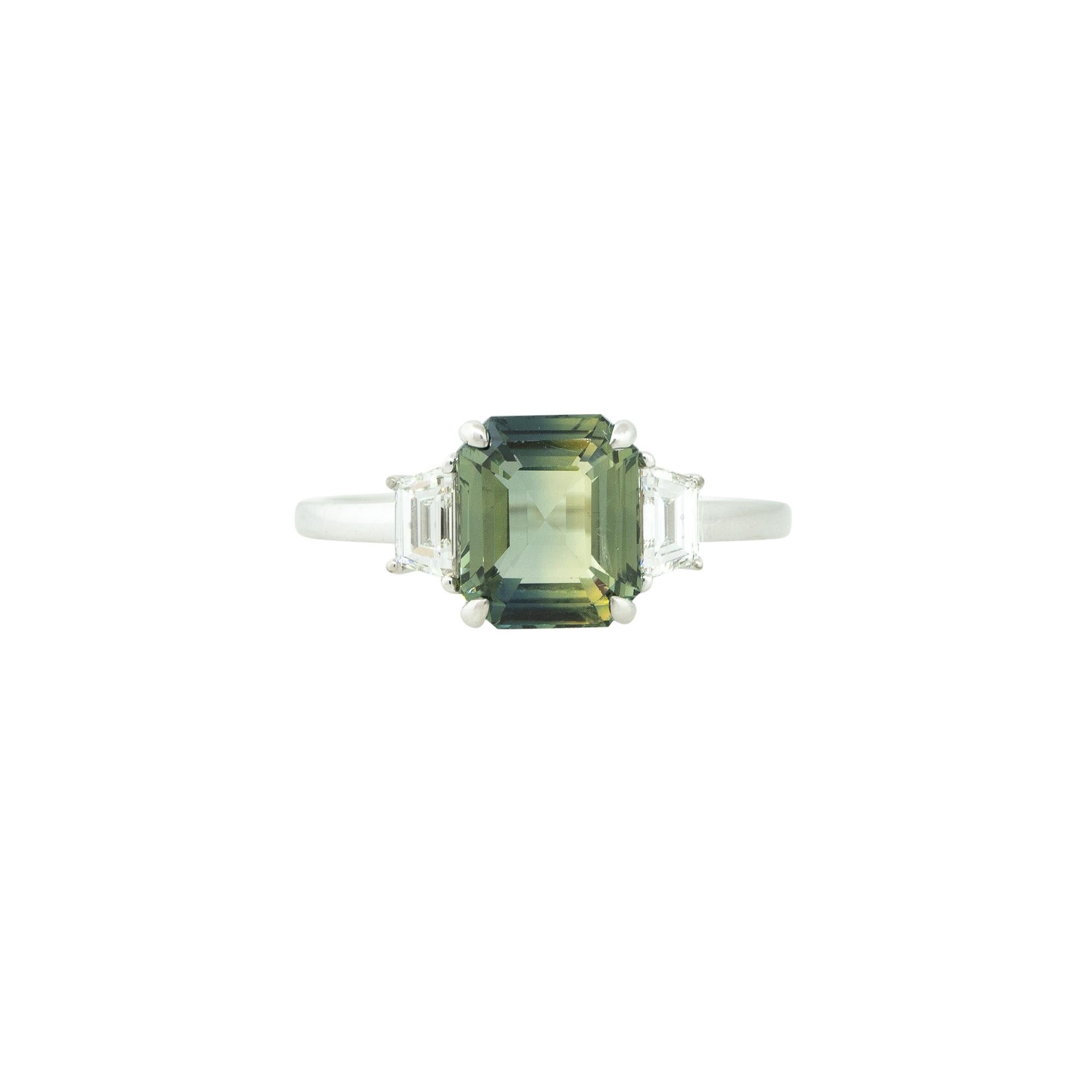 18 Karat White Gold 3.03 Carat Sapphire and Diamond Trapezoid Side Stone Ring
Style: Women's Sapphire and Diamond Ring
Material: 18 Karat White Gold
Main Gemstone Details: The Sapphire is approximately a 3.03 Carat Octagonal Step Cut Sapphire. The