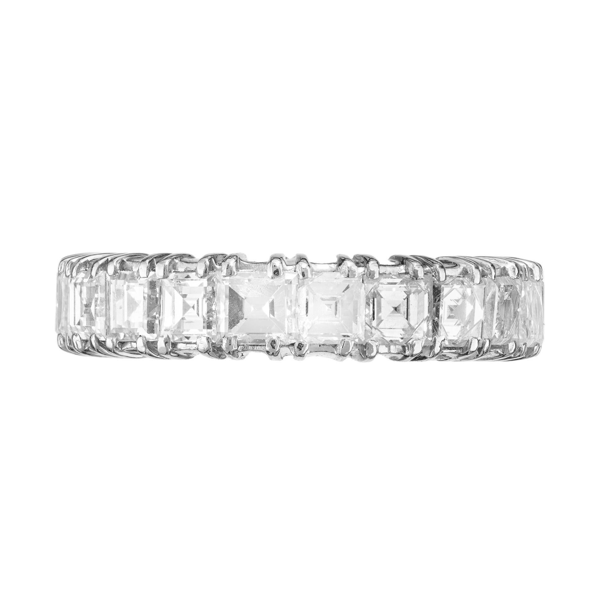 This 1940's handmade diamond platinum eternity wedding band ring is a dazzling testament to eternal love. Set with 21 square step cut diamonds that have an approximate total weight of 3.03cts. Each square diamond is meticulously set to create a