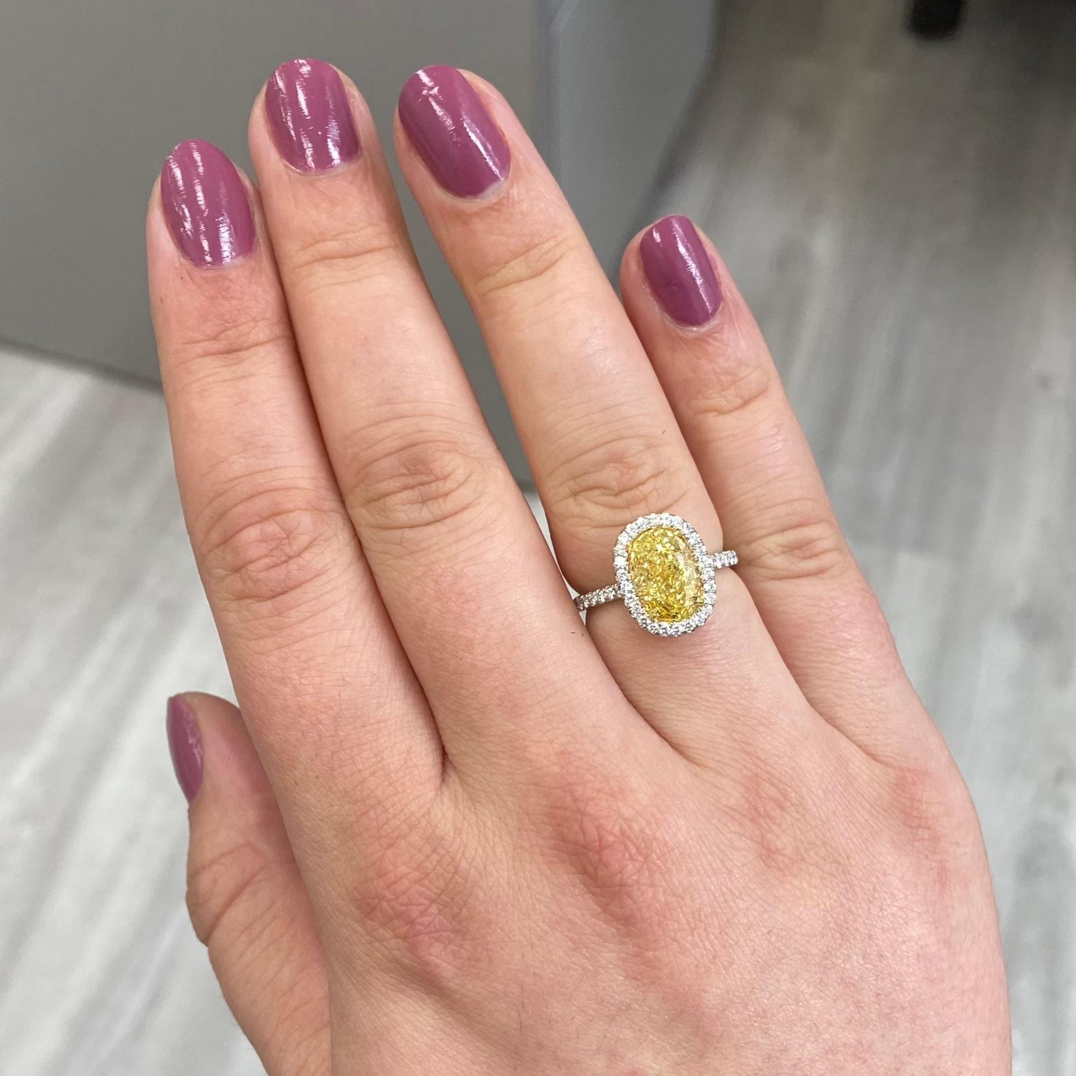 Oval Cut 3 Carat Fancy Yellow Oval Diamond Halo Ring For Sale