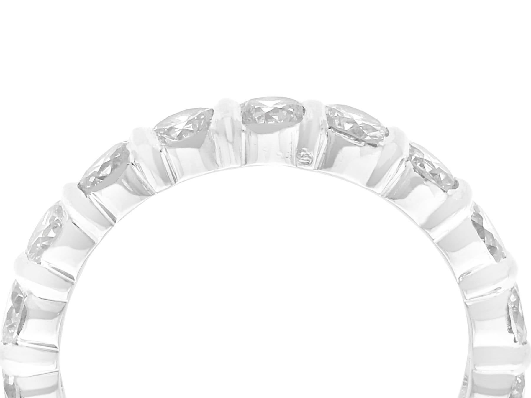 This stunning, fine and impressive vintage eternity ring has been crafted in 18k white gold.

The ring is ornamented with a total of eighteen impressive claw set transitional modern brilliant round cut diamonds, totaling 3.04cts.

The eternity ring