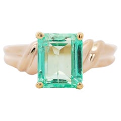 3.04 Carat Emerald Cut Emerald 14K Yellow Gold Curved Shank Solitaire Ring