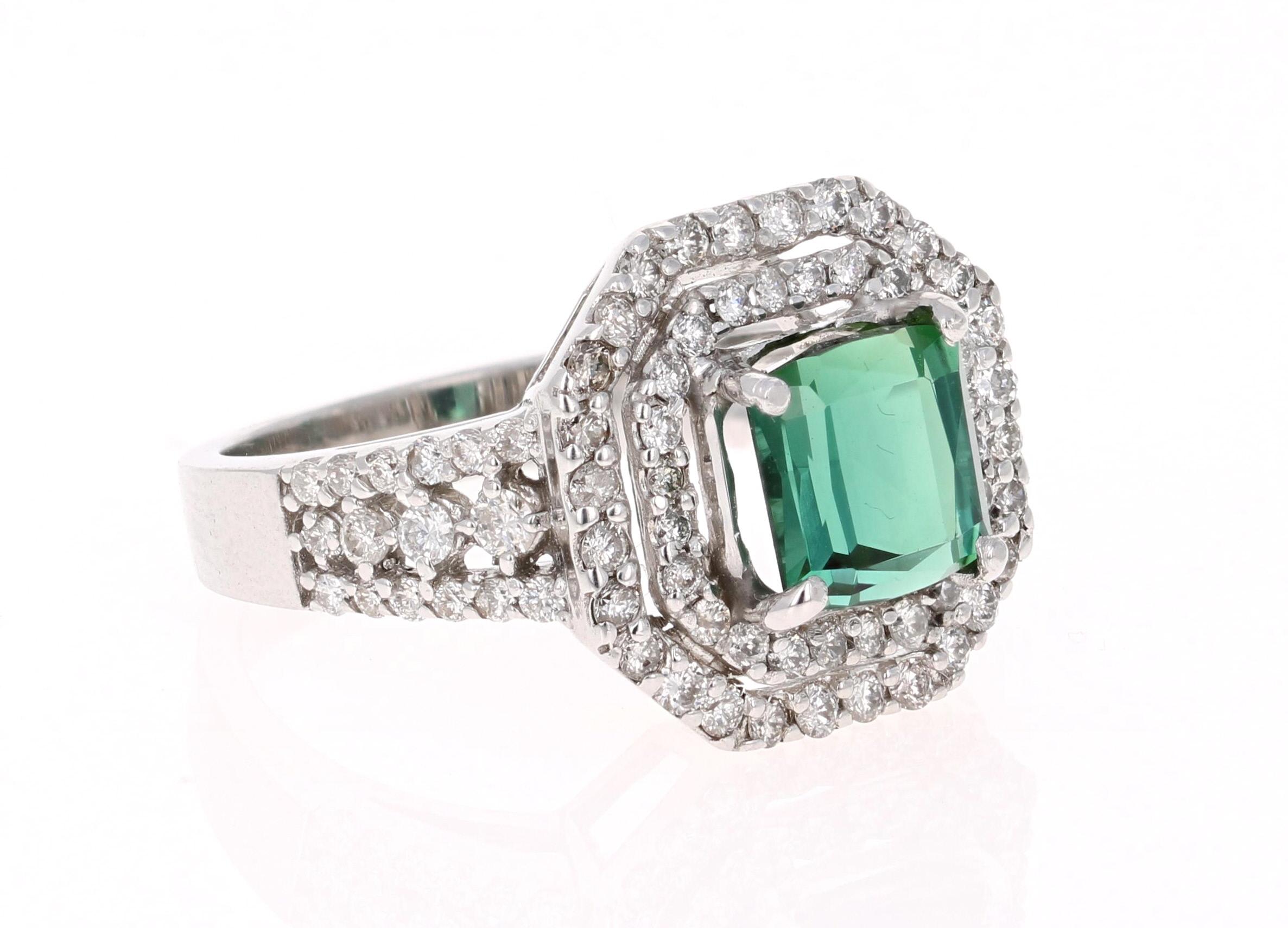 This beautifully designed ring has an Asscher cut Green Tourmaline that weighs 2.15Carats and is surrounded by 84 Round Cut Diamonds that weigh 0.89 Carats (Clarity: SI, Color: F). The total carat weight of the ring is 3.04 Carats. 
The ring is made