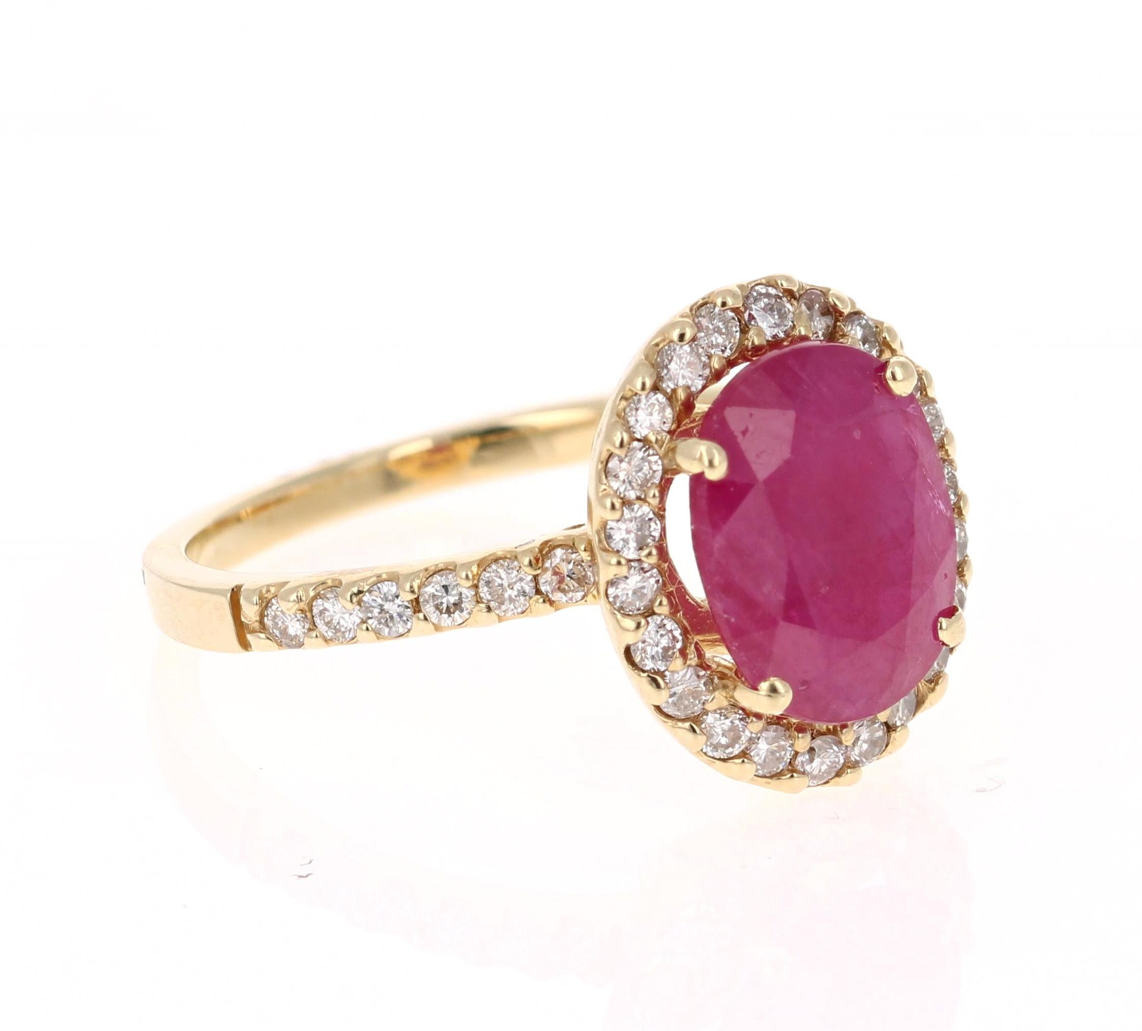 Simply beautiful Ruby Diamond Ring with a Oval Cut 2.59 Carat Ruby which is surrounded by 34 Round Cut Diamonds that weigh 0.45 carats. The total carat weight of the ring is 3.04 carats. The clarity and color of the diamonds are VS-H.

The ring is