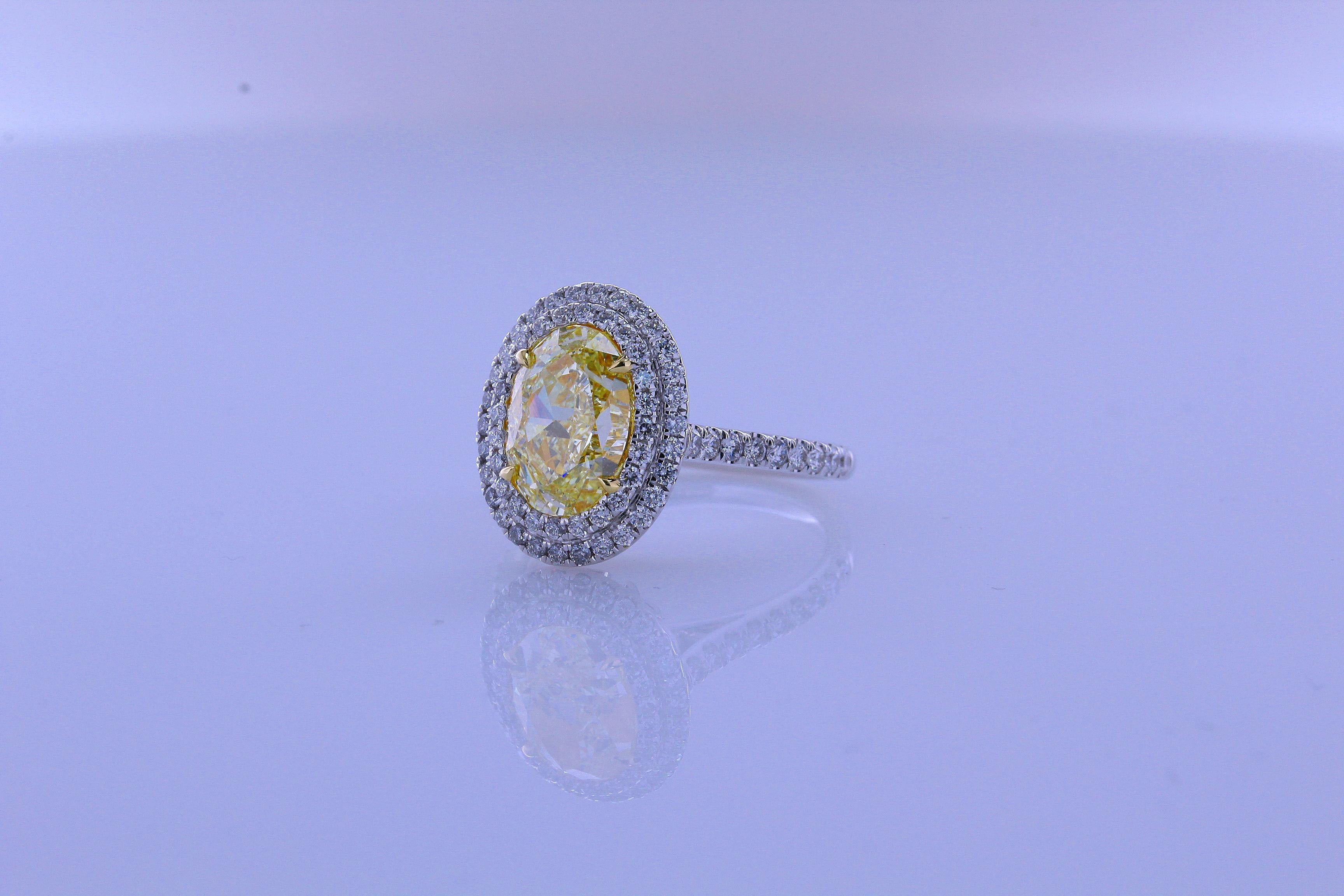 Incredible Deal on 3.04 Carat Oval Cut, Natural Fancy Yellow Color VS1 Clarity Diamond 18 Karat White Gold Convertible Ring/Pendant.
10.39x7.24x5.07 millimeter. Total Carat Weight on the ring is 3.74. 

This Beautiful Ring converts into pendant with