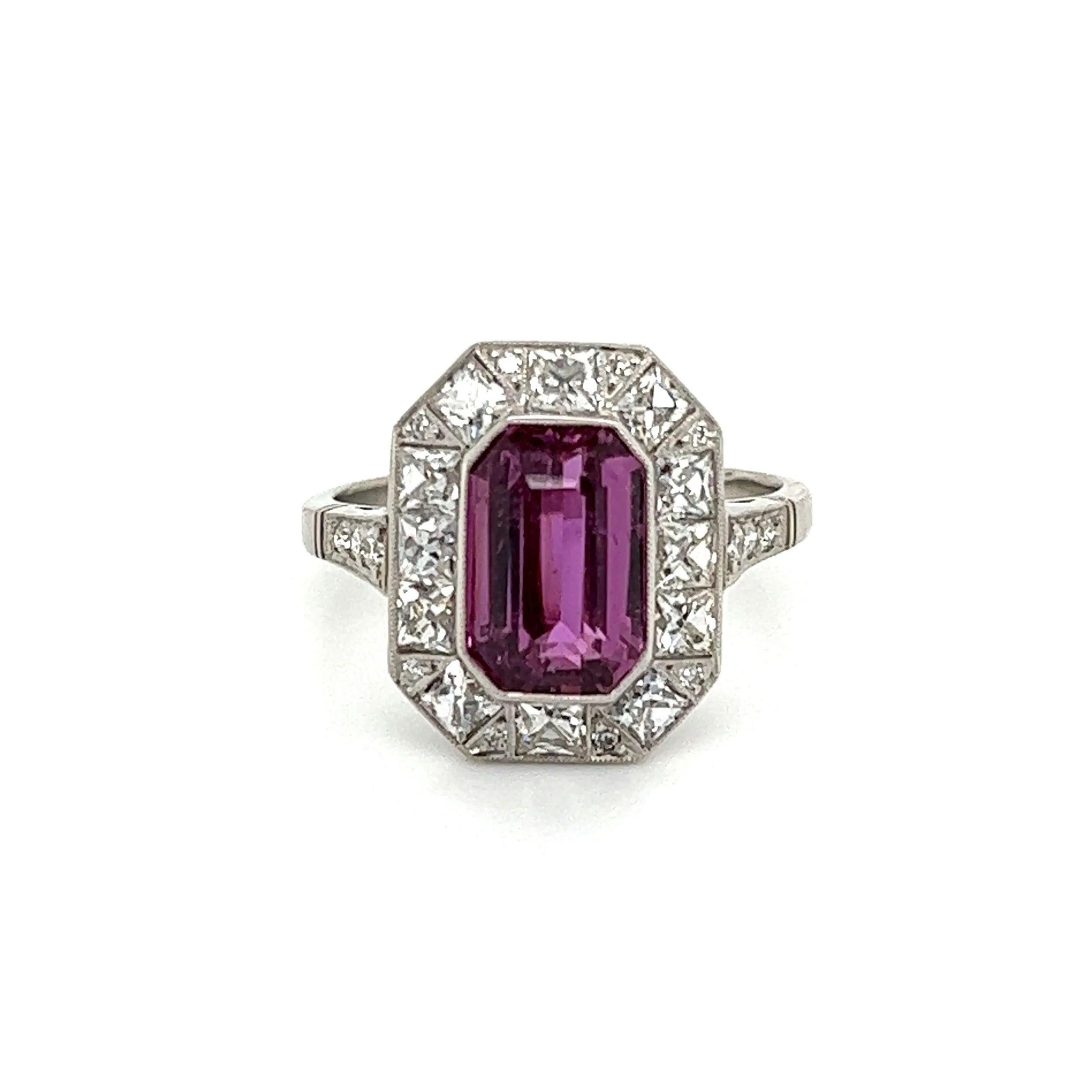 Simply Beautiful! Finely detailed Emerald Cut Purple Pink Sapphire and Diamond Platinum Vintage Cocktail Ring. Centering a securely nestled Emerald-Cut Purple Pink Sapphire, weighing approx. 3.04 Carats. Surrounded by Diamonds, weighing approx.
