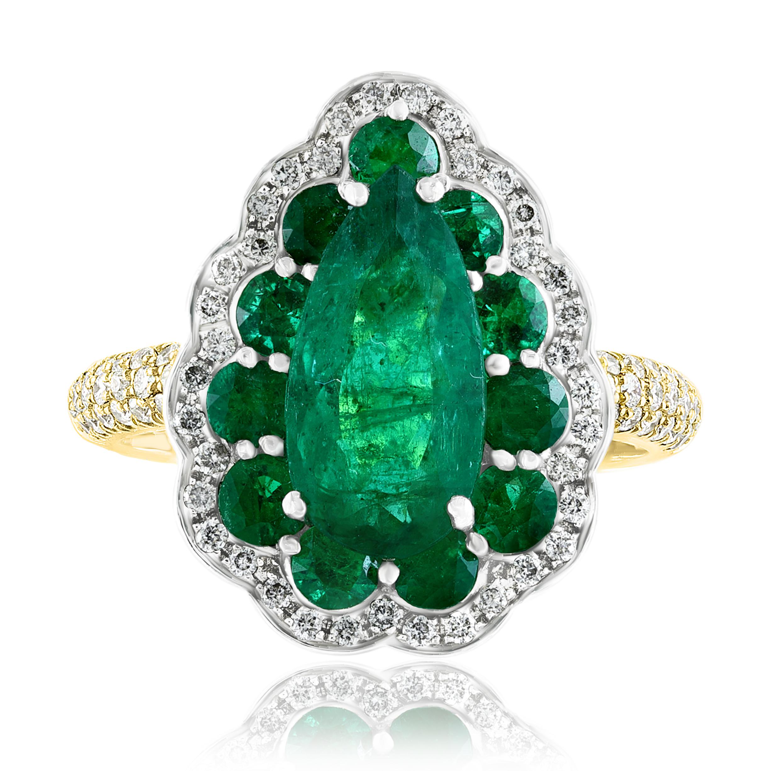 This cocktail ring features Pear shape Emerald weighing 3.04 carats total and 80 round brilliant diamonds weighing 0.53 carats total. Surrounding the center stone there are 11 round brilliant cut emeralds. Made with 18k yellow gold. 

Size 6.5 US