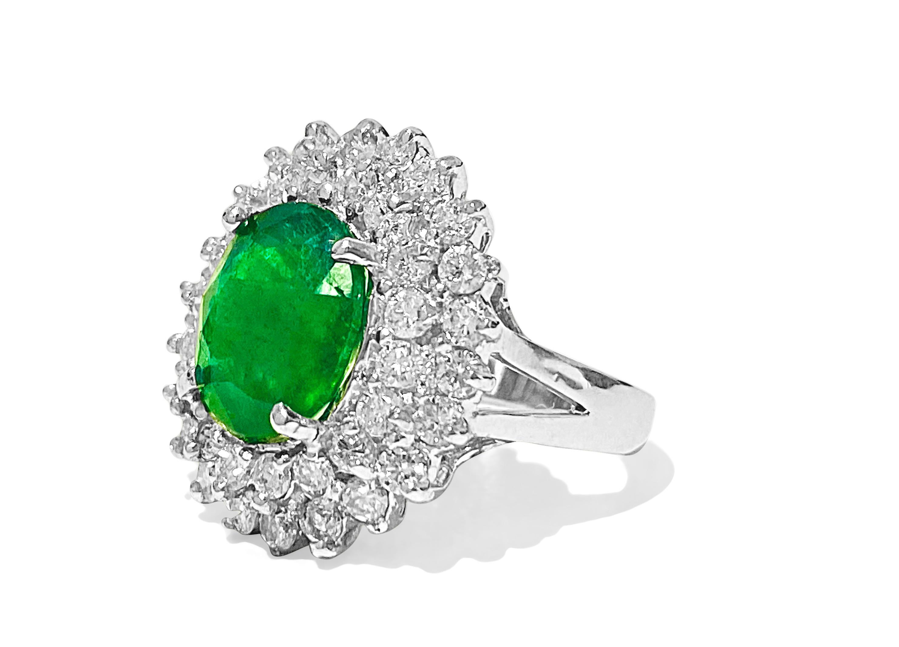 Metal: 14k white gold. 

3.05 carat emerald. 100% natural earth mined emerald. Oval shape set in prongs. 
1.50 carat diamonds, VS-SI clarity and F-G color. Round brilliant cut diamonds set in prongs. 100% natural earth mined and genuine diamonds.