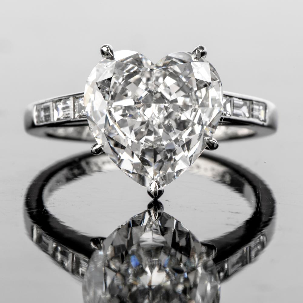 Show her your heart!!

Picture the moment you place this astonishing Heart

Shaped Diamond Platinum engagement ring on her hand.

Featuring an incredible GIA certified 3.05 carat, E color 

and VS2 clarity diamond centered atop.

The tapering band
