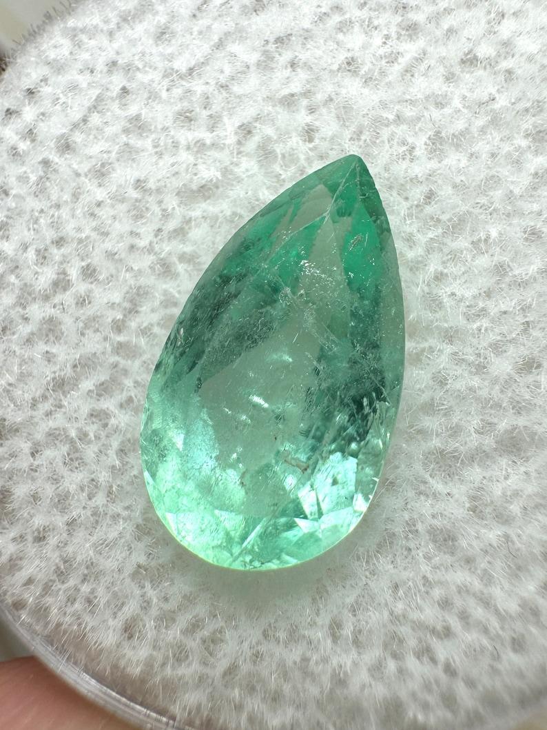 Stone: Emerald
Weight: 3.05-carats
Shape: Pear Cut
Clarity: Transparent
Luster: Very Good
Color: Light Green
Measurements: 12.69mm x 7.18mm x 5.55mm
Geographic Origin: Colombia
Treatment: Natural, Oiling

Comments: Due to their growth conditions in