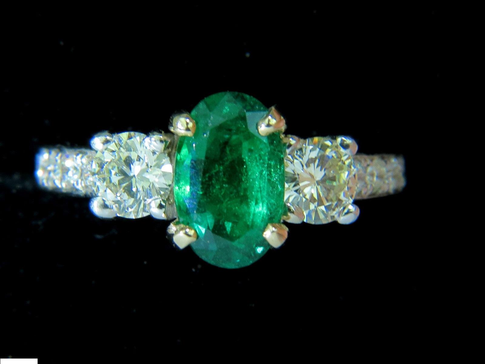 1.45ct. Natural Emerald

Zambian origin

Yes, the green sparks are within this one!

Clean clarity

9.4 X 5.9mm

Transparency A+



2 Side round diamonds: .80ct.

I-color, Vs-2 clarity

Full Cuts 



Additional side diamonds on shank:

micro set 16
