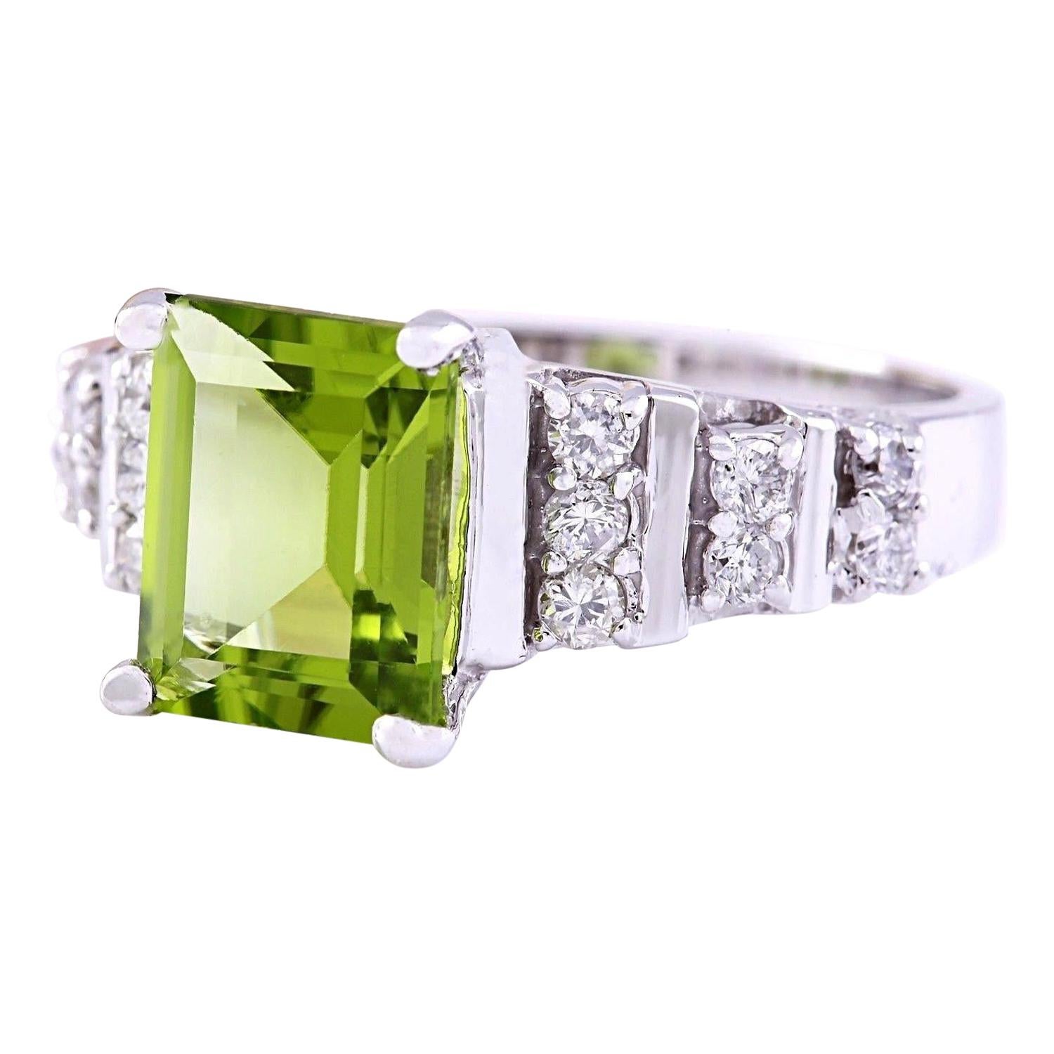 Introducing our stunning 14K Solid White Gold Diamond Ring adorned with a captivating 3.05 Carat Natural Peridot centerpiece. Crafted with precision and elegance, this ring is a true statement of sophistication. The mainstone, a vibrant Peridot