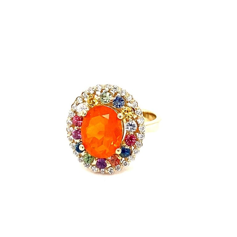 Contemporary 3.05 Carat Oval Cut Fire Opal Sapphire Diamond Yellow Gold Cocktail Ring For Sale