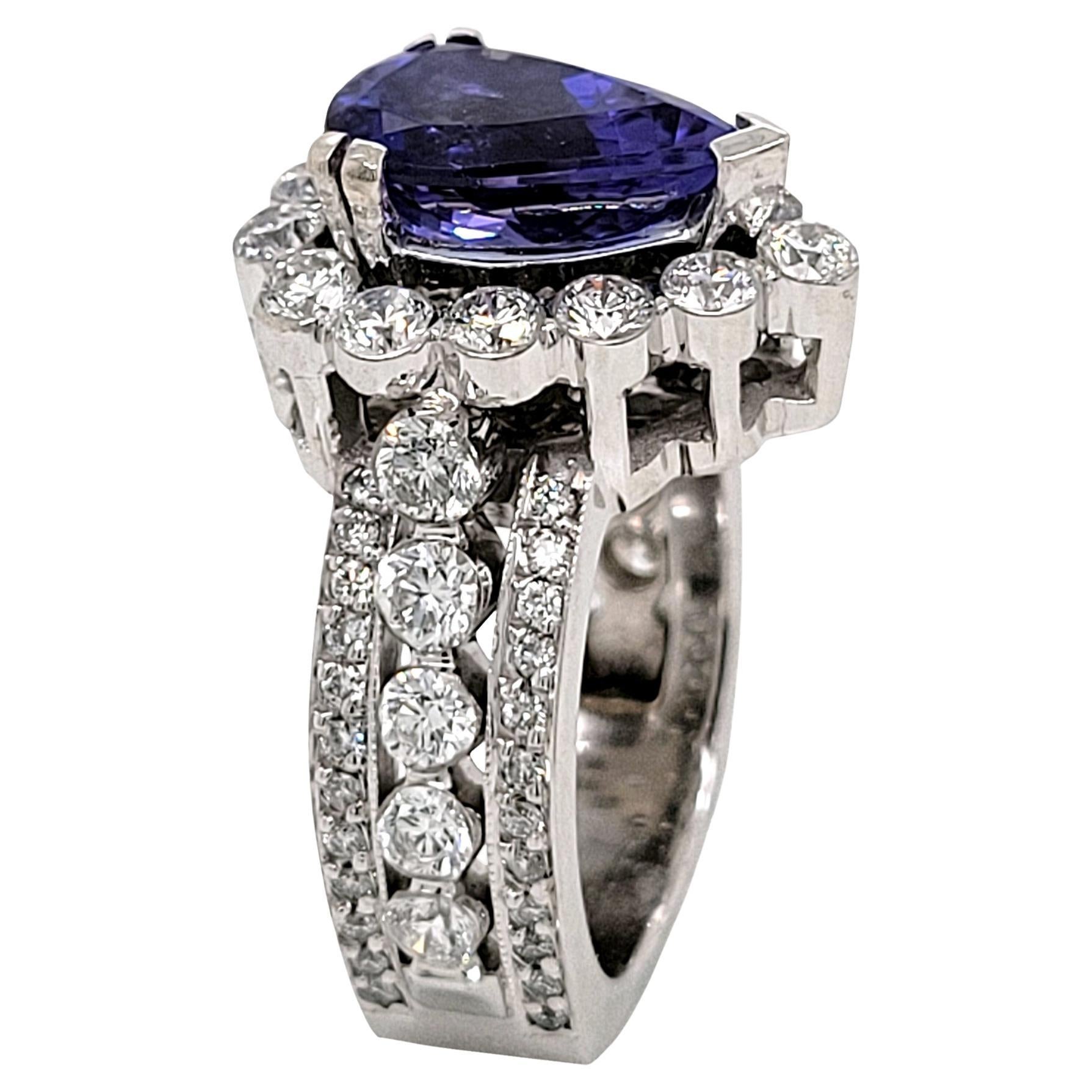 3.05 Carat Pear Shape Tanzanite 18 Karat Engagement Ring with Halo For Sale