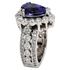 Bague de fiançailles en or 18 carats avec tanzanite en forme de poire de 3,05 carats et halo