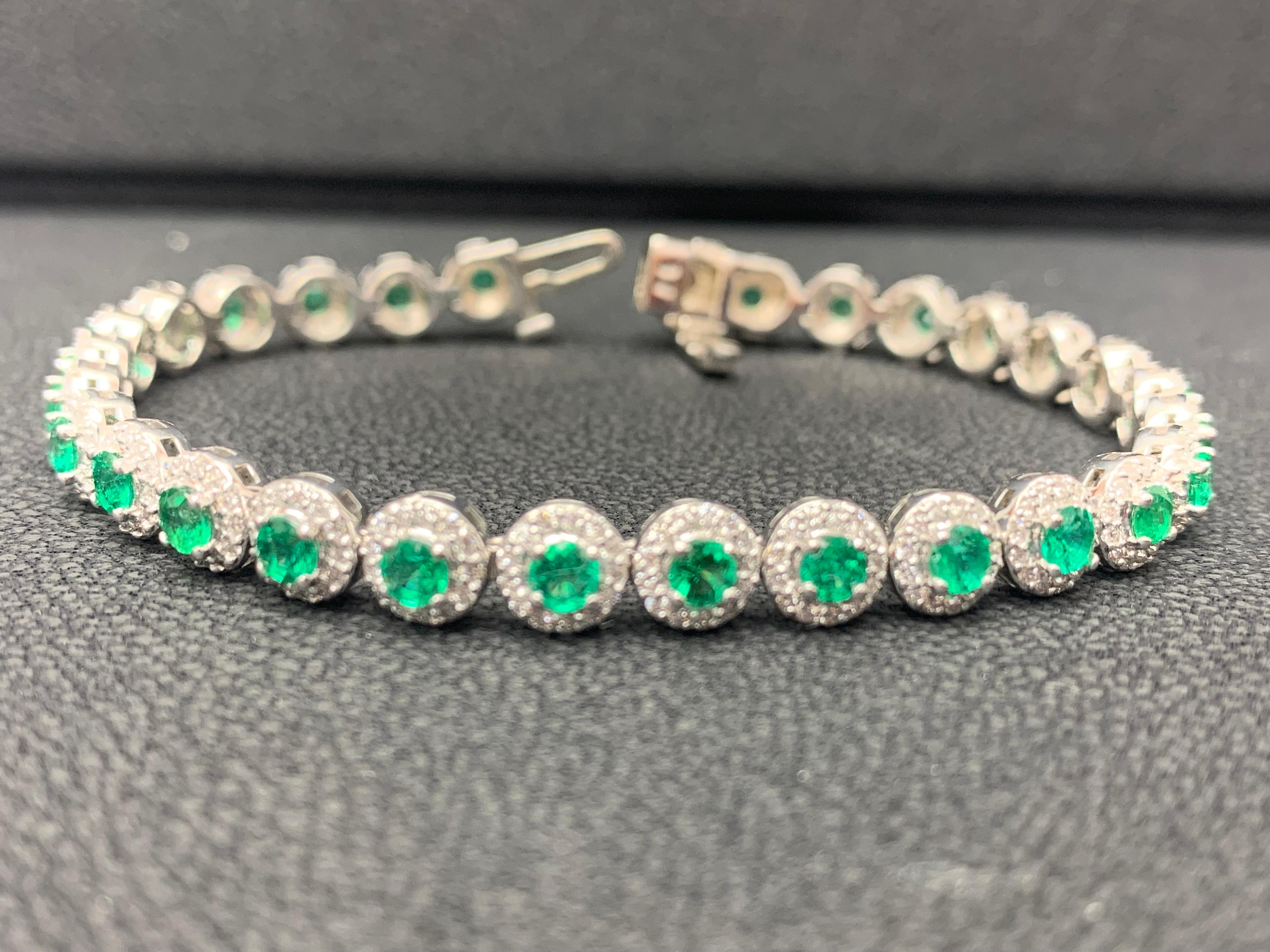 Add color to your style with this gorgeous emerald bracelet. Features 29 Round cut lush green emeralds surrounded by a single row of sparkling round diamonds in a halo setting. Emeralds and diamonds weigh 3.05 carats and 1.57 carats total