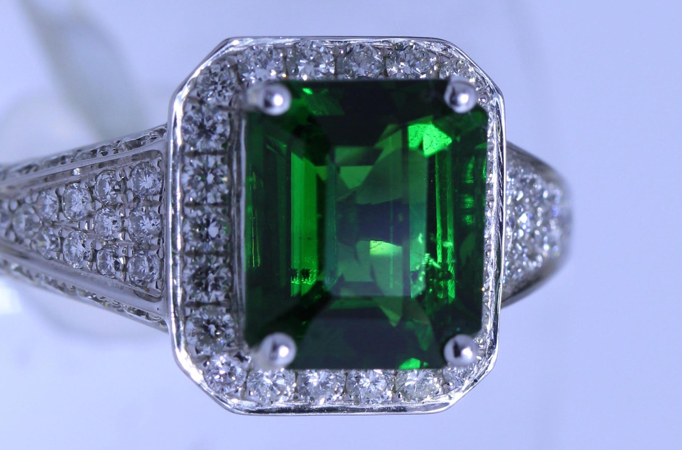 Gem Quality Flawless Rich Green Tsavorite - Emerald Cut Shape - 3.05 carat
Studded with 1.04 carat Fine Diamonds
Beautiful mounting in 18k White Gold