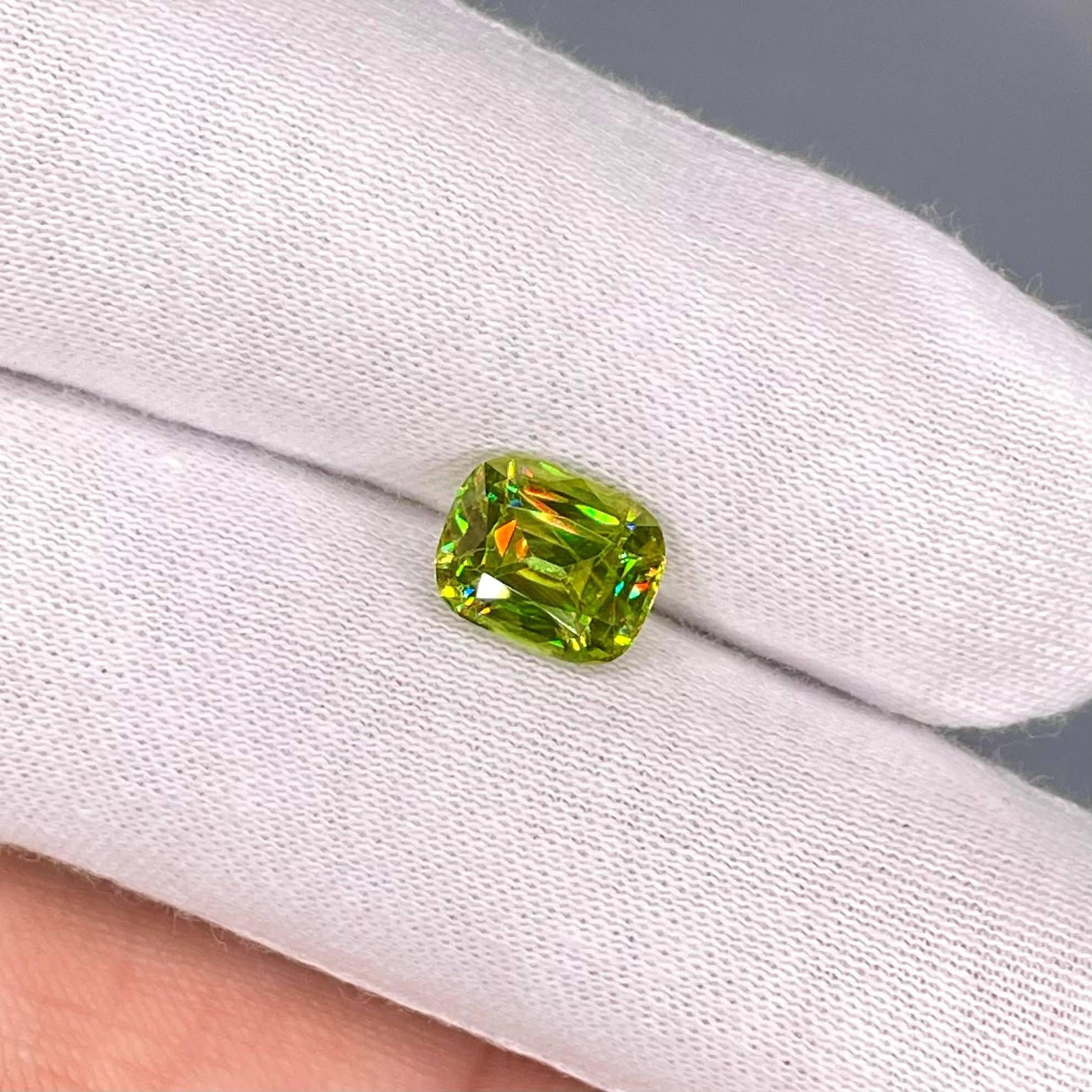 Weight 3.05 carats
Dimensions 9.4x7.5x5.2 mm 
Treatment none 
Origin Madagascar 
Clarity VVS 
Shape cushion 
Cut fancy cushion 



The exquisite beauty of a 3.05 carat Green Sphene stone unfolds in this fine example of a gem from Madagascar.