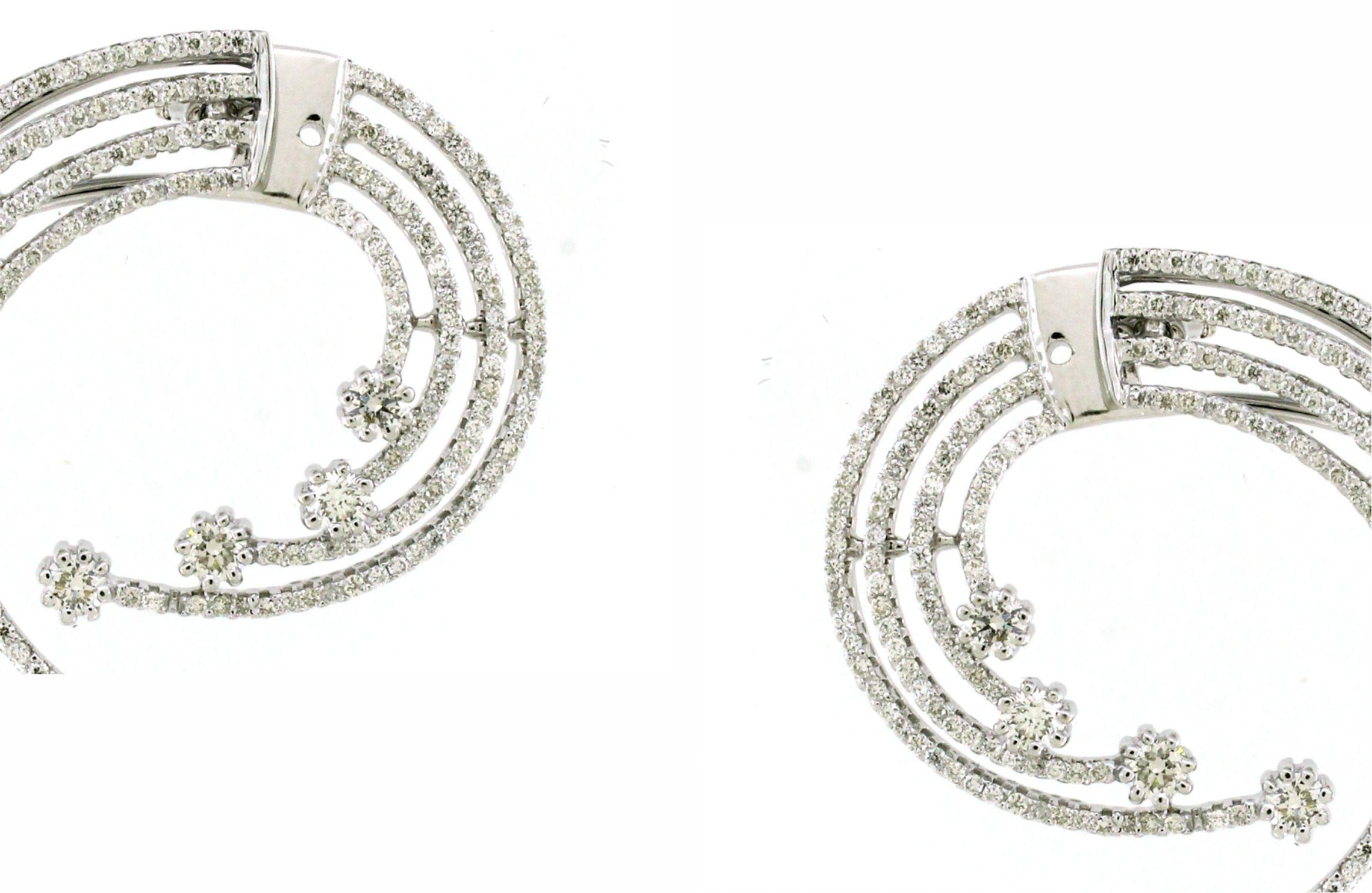 Step into the celestial realm with our Stardust Galaxy Earrings, a dazzling testament to celestial beauty and elegance. Each earring boasts a mesmerizing array of 535 white round diamonds, totaling an impressive 3.05 carats collectively, creating a