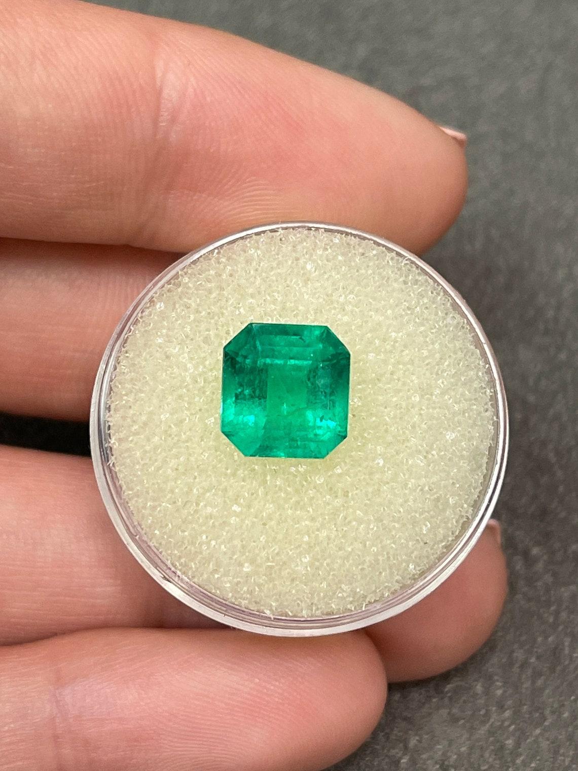 Stone: Emerald
Weight: 3.05-carats
Shape: Asscher Cut
Clarity: Transparent
Luster: Excellent
Color: Vivid Green
Measurements: 9.30mm x 8.76mm
Geographic Origin: Colombia
Treatment: Natural, Oiling

Comments: Due to their growth conditions in nature